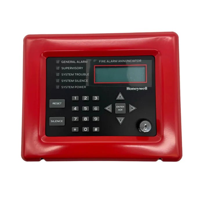 Silent Knight 005860R fire alarm control panel with display and control buttons, mounted on a wall.