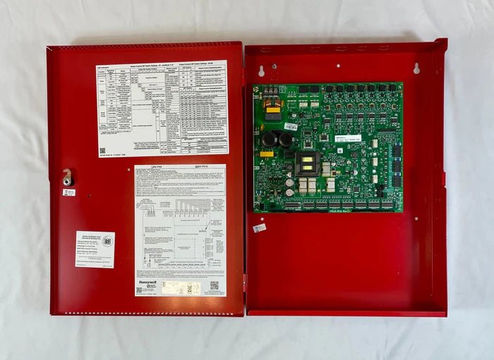 Silent Knight SK-PS10 fire alarm control panel mounted on a wall with wiring and indicator lights for security system monitoring.