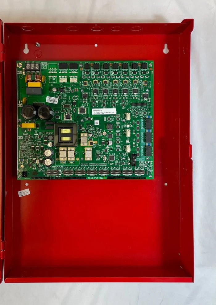 Silent Knight SK-PS10 fire alarm control panel mounted on a wall, featuring a sleek black design with indicator lights and control buttons.