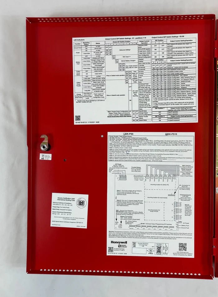 Silent Knight SK-PS10 fire alarm panel with sleek black design, mounted on a wall with indicator lights and control buttons.