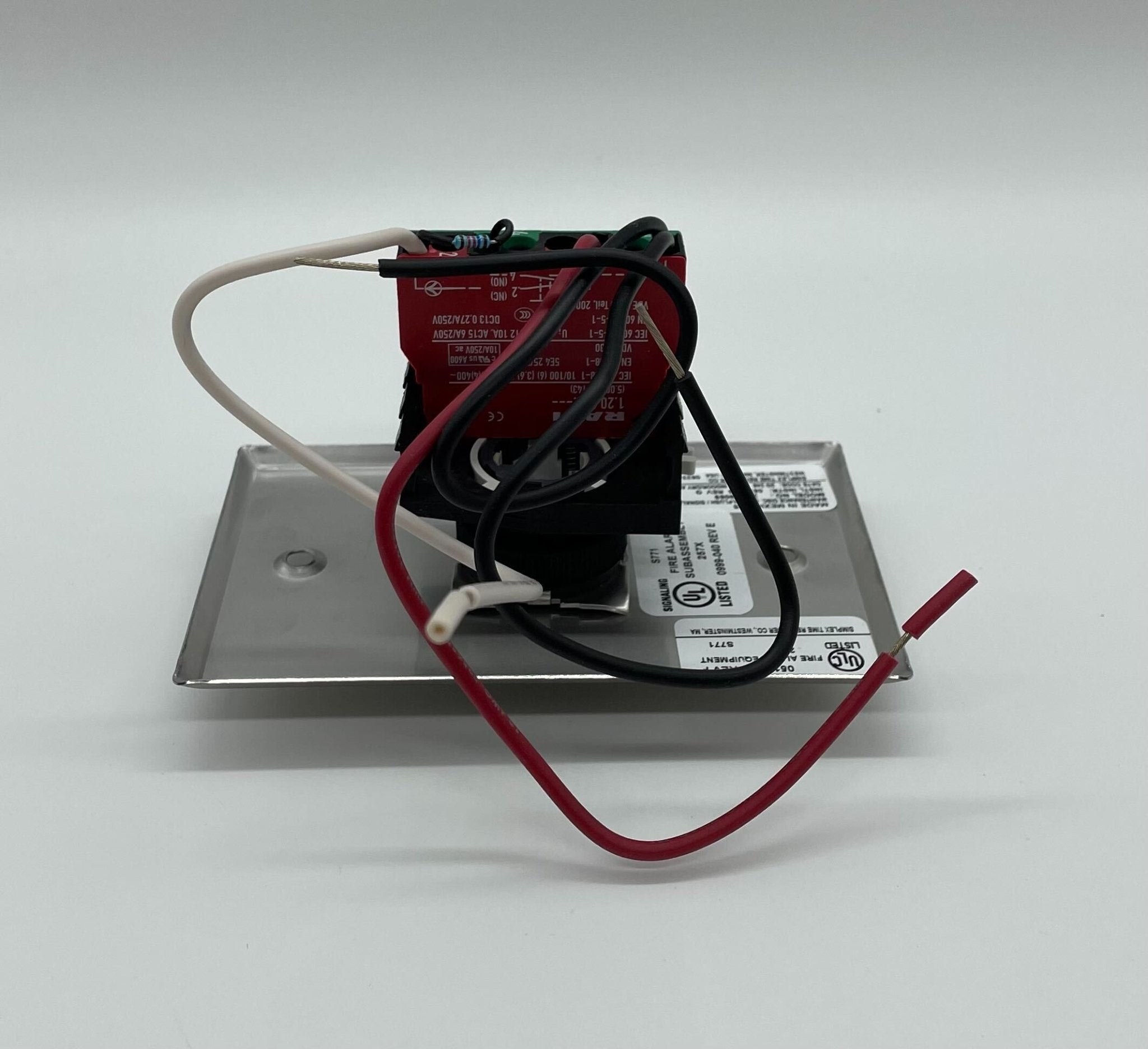 Simplex 2080-9069 fire alarm with digital display and alarm indicators, mounted on a wall for building safety.
