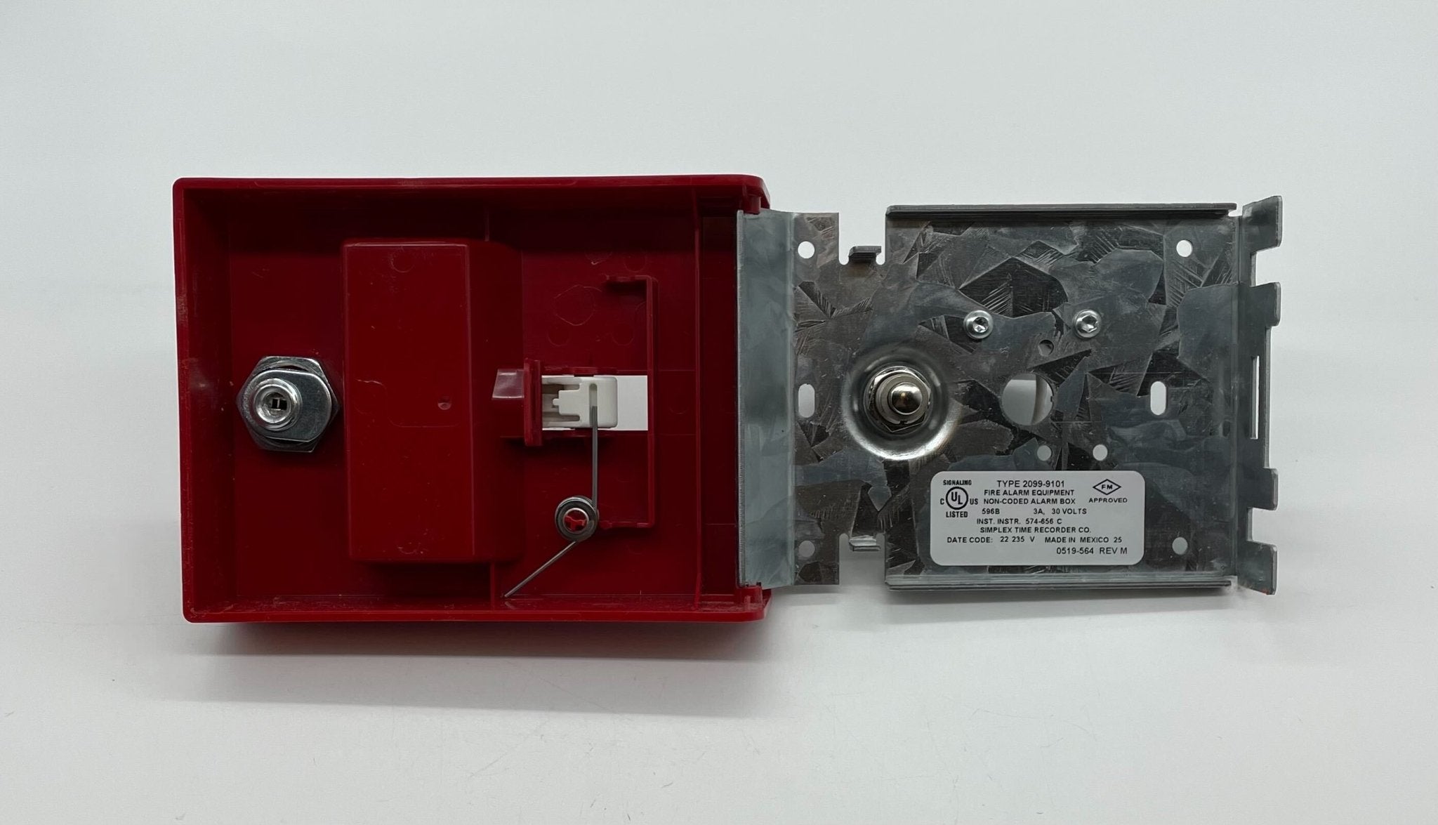 Simplex 2099-9101 pull station fire alarm switch mounted on a wall with visible label and wiring.