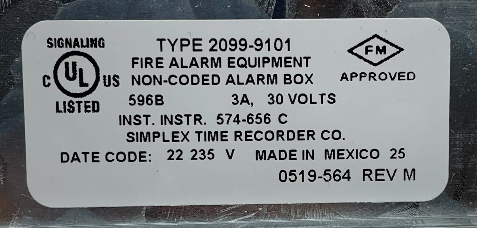 Simplex 2099-9101 pull station alarm switch mounted on wall, used for emergency notification in safety systems
