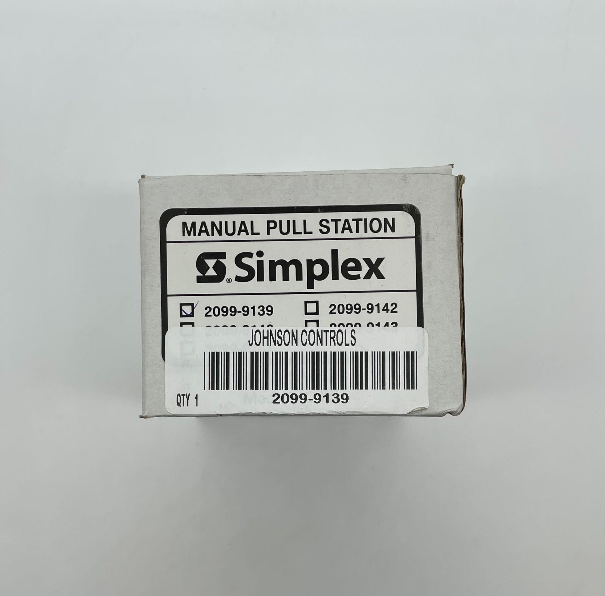 Simplex 2099-9139 pull station alarm switch mounted on a wall for emergency fire safety.