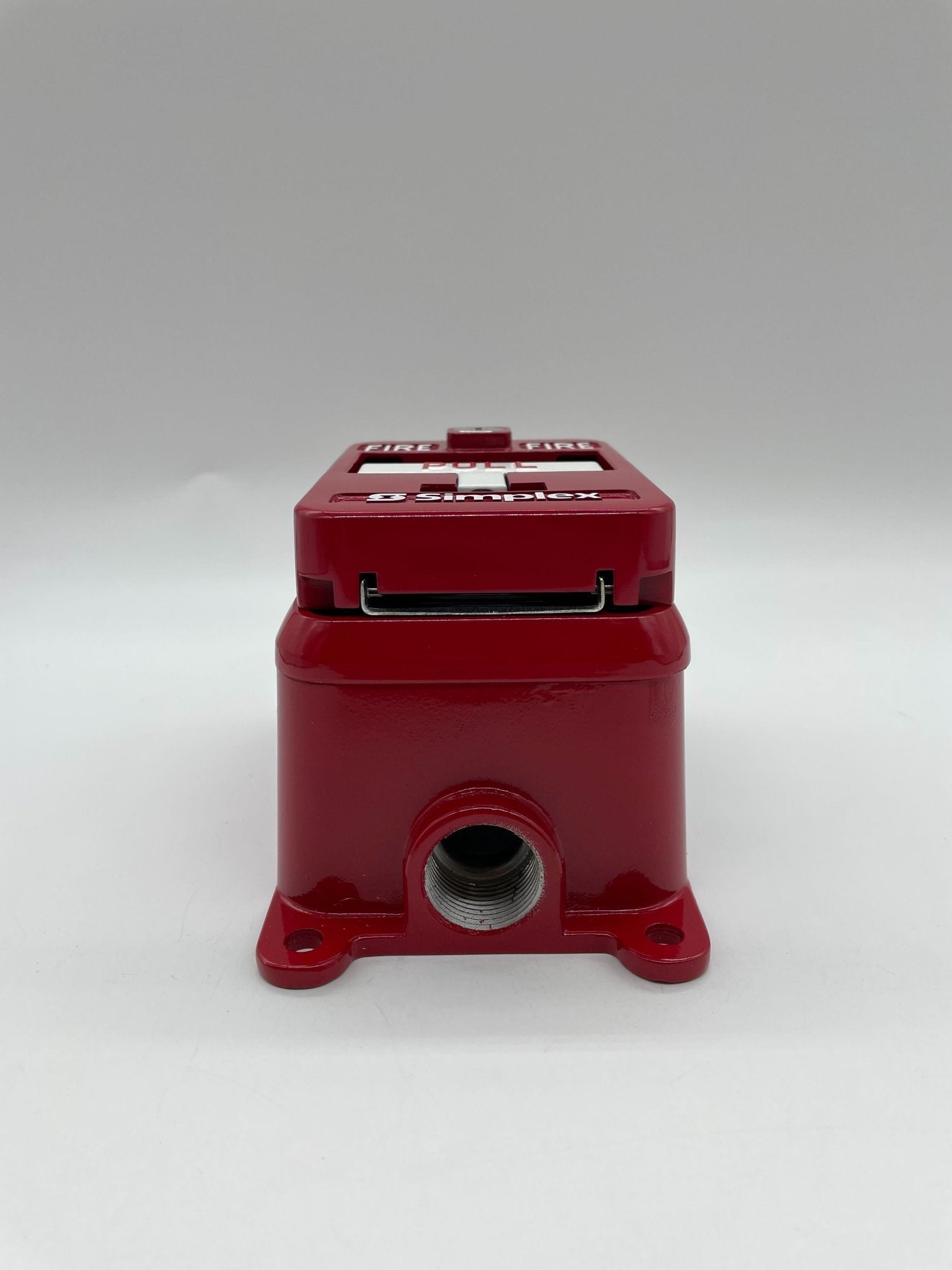 Simplex 2099-9144 pull station alarm device mounted on wall, used for emergency notification, by Simplex.