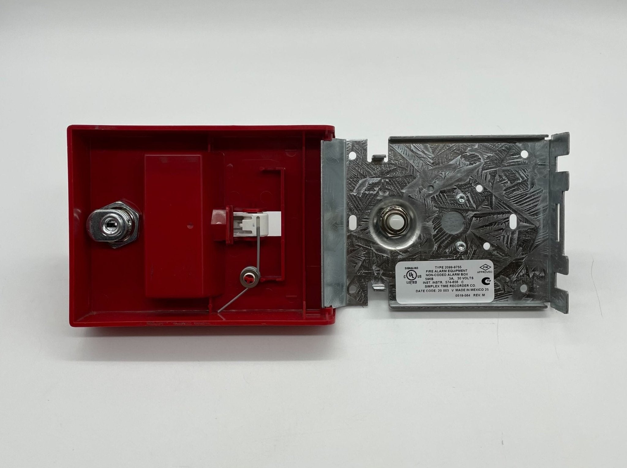 Simplex 2099-9755 pull station fire alarm device with red casing and emergency label, mounted on a wall.