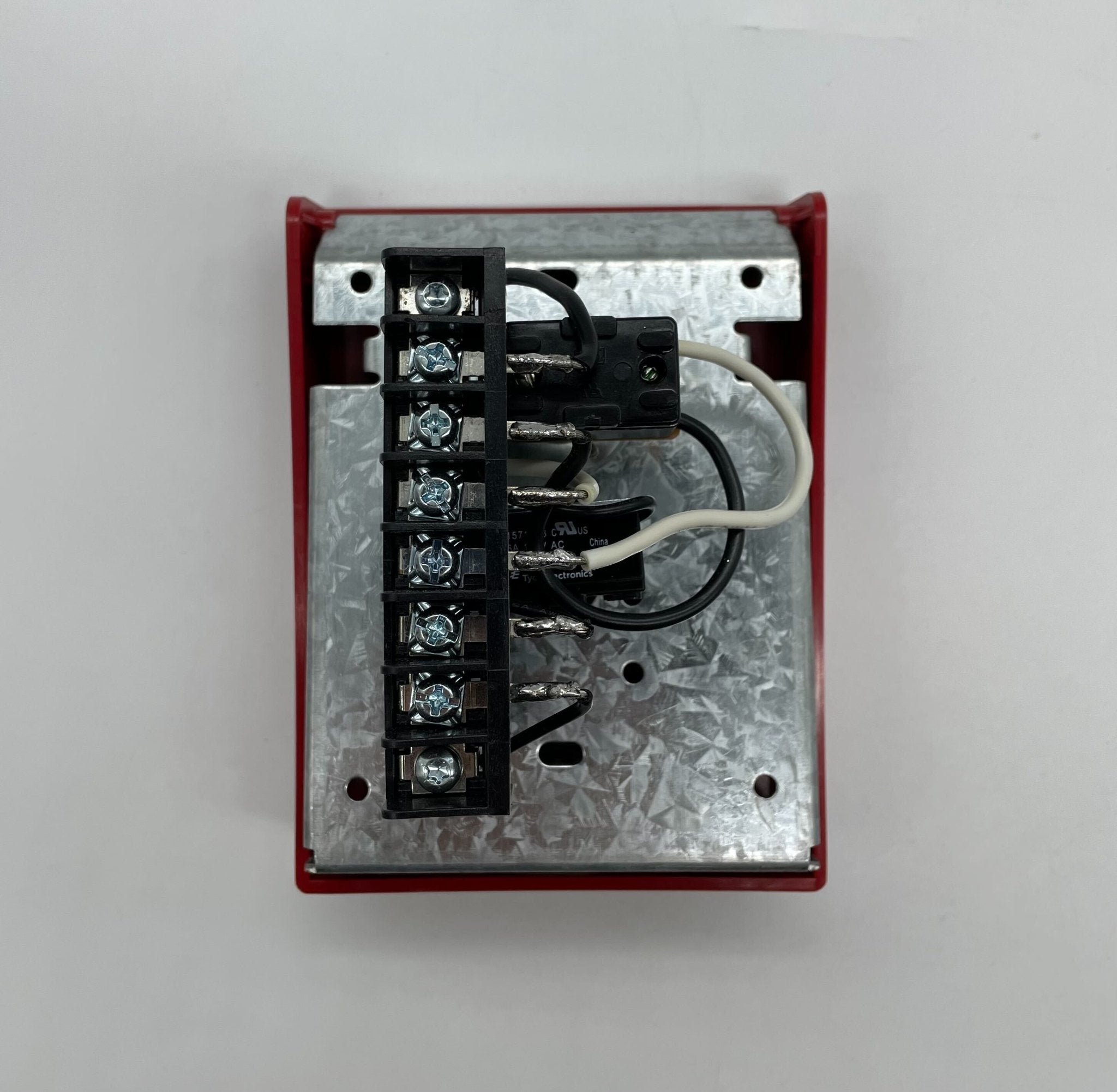 Simplex 2099-9759 pull station fire alarm device with black and red design mounted on a wall