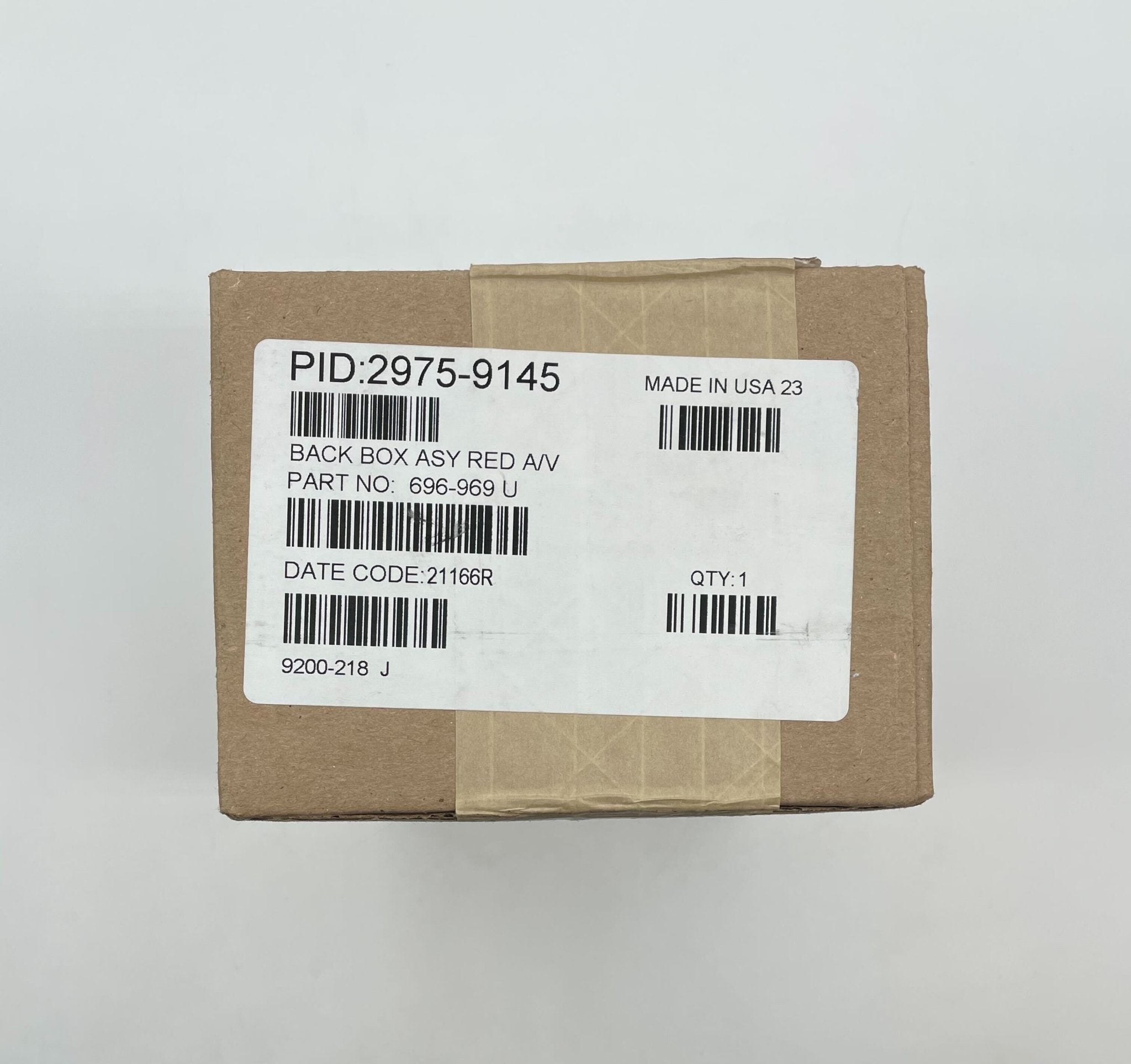 Simplex 2975-9145 fire alarm with white plastic casing, mounted on a wall, designed for safety and fire detection.