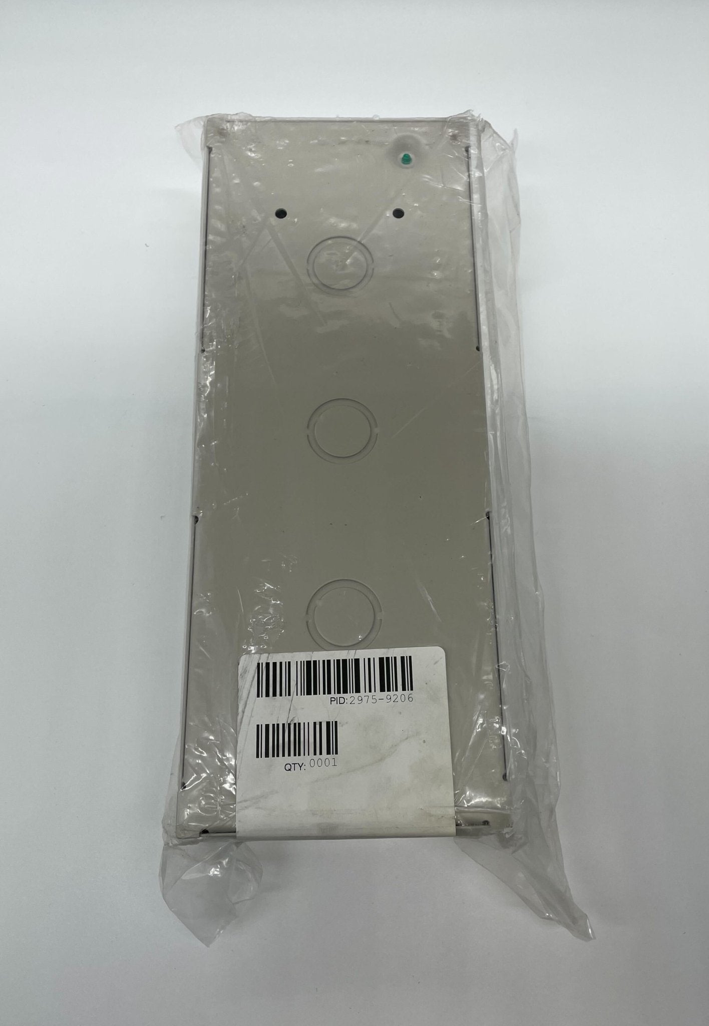 Simplex 2975-9206 fire alarm with a round smoke detector and test button, mounted on a white ceiling.
