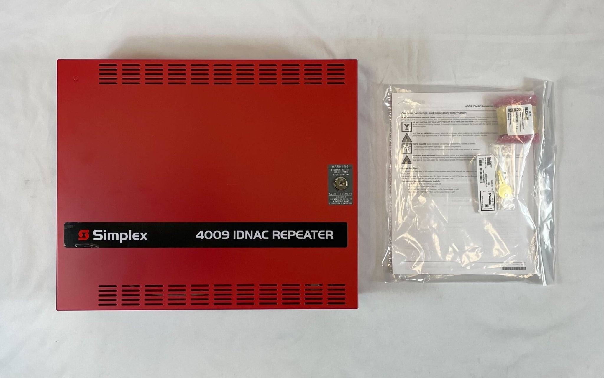 Simplex 4009-9602 fire alarm control panel with digital display and control buttons, mounted on a wall.