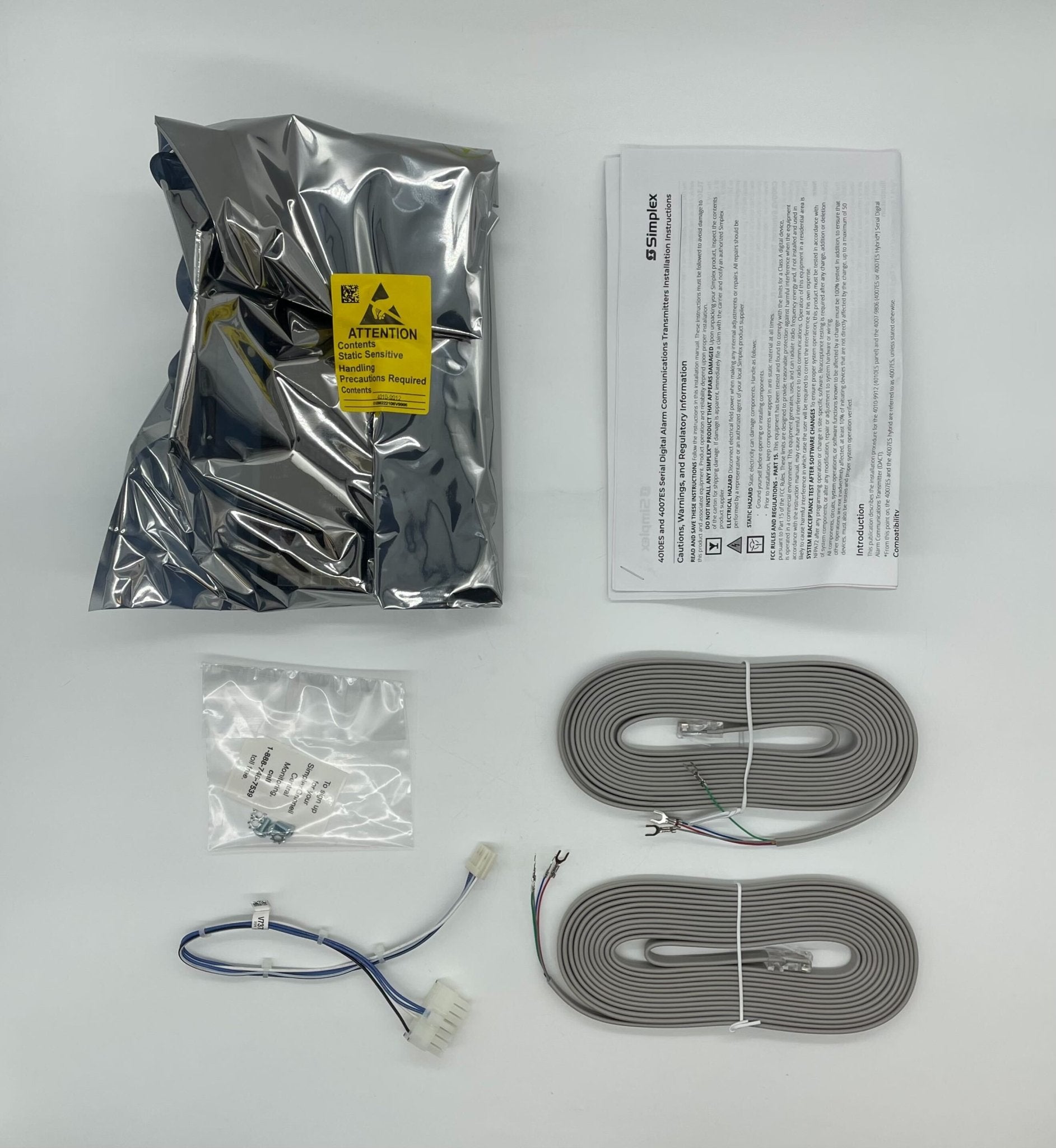 Simplex 4010-9912 fire alarm device with electronic components, part of Simplex's fire alarm system.