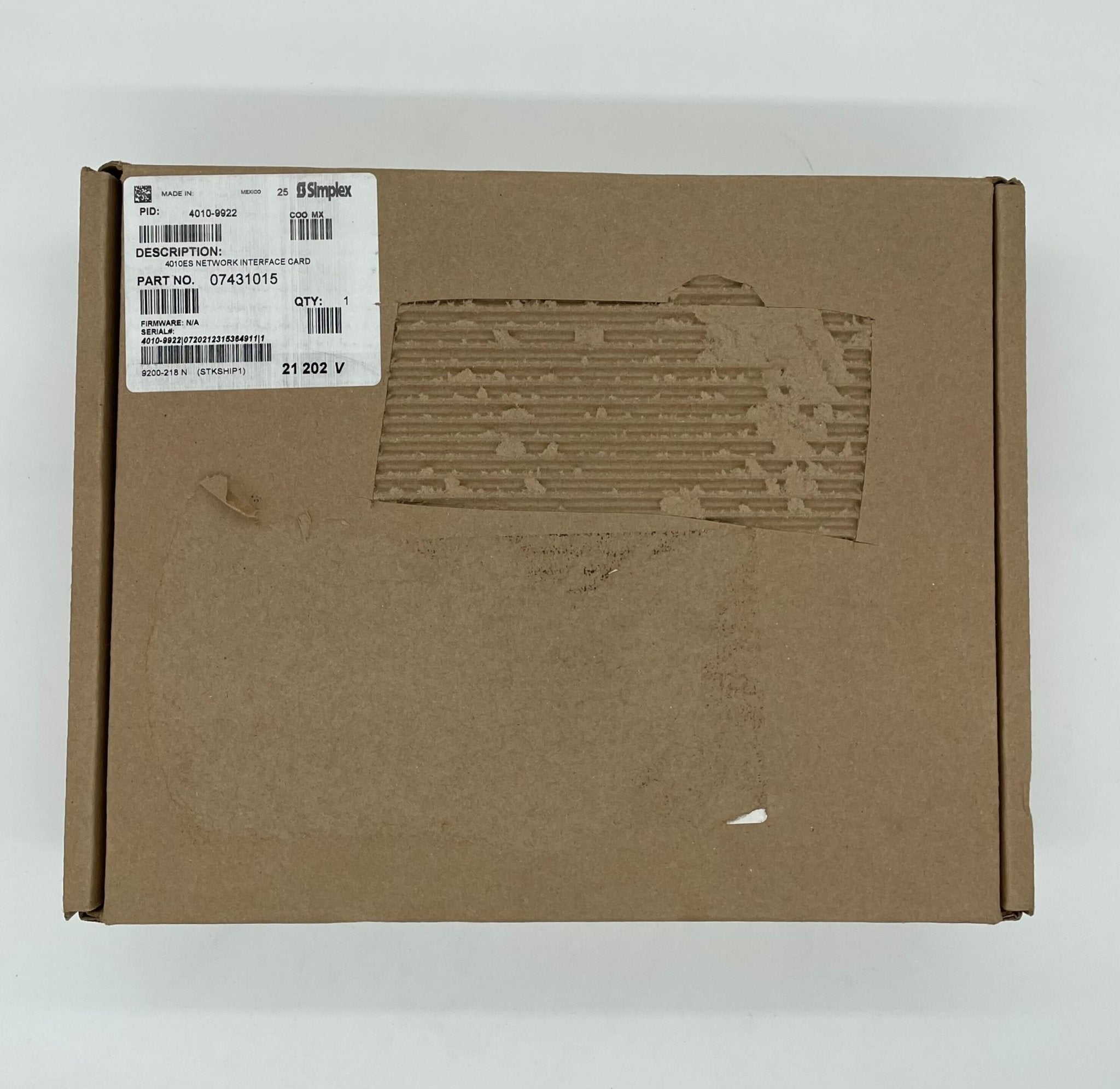 Simplex 4010-9922 fire alarm with a white plastic casing and mounting bracket, designed for building safety.
