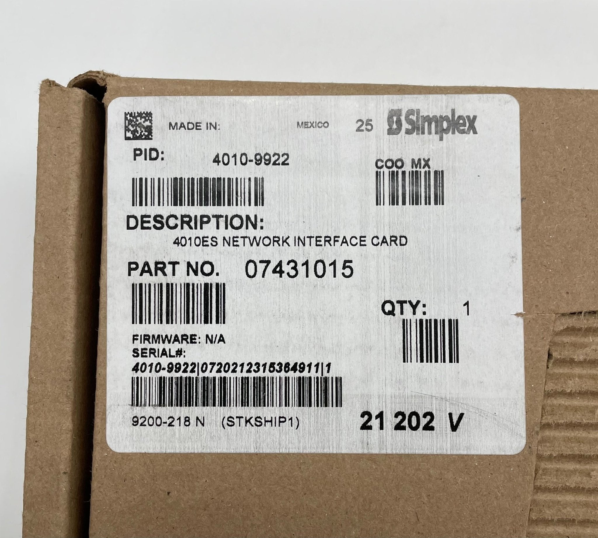 Simplex 4010-9922 fire alarm device with alert button and wiring, designed for emergency notification and safety detection.