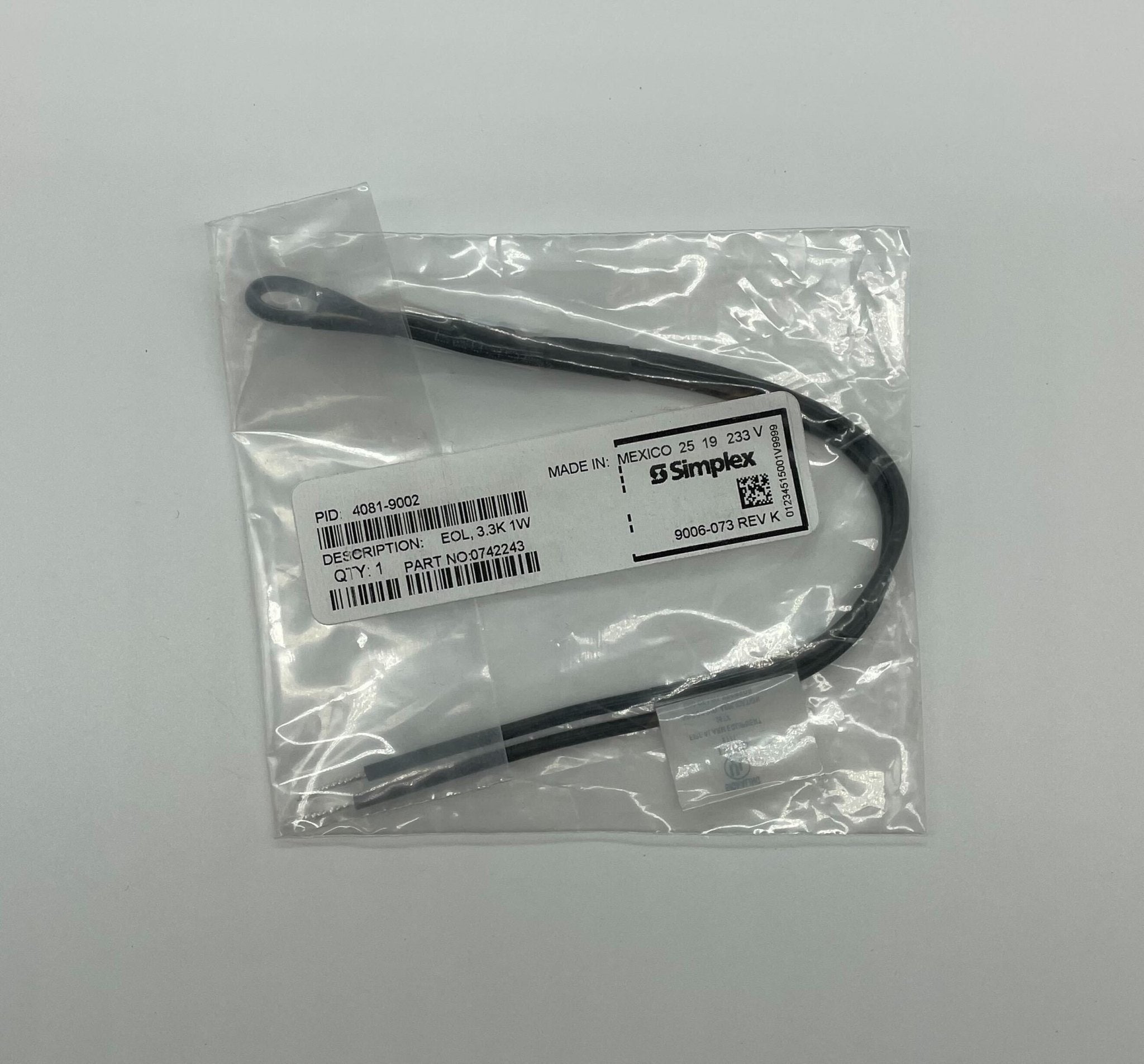 Simplex 4081-9002 EOL resistor featuring a compact design, with visible metal terminals and printed specifications.