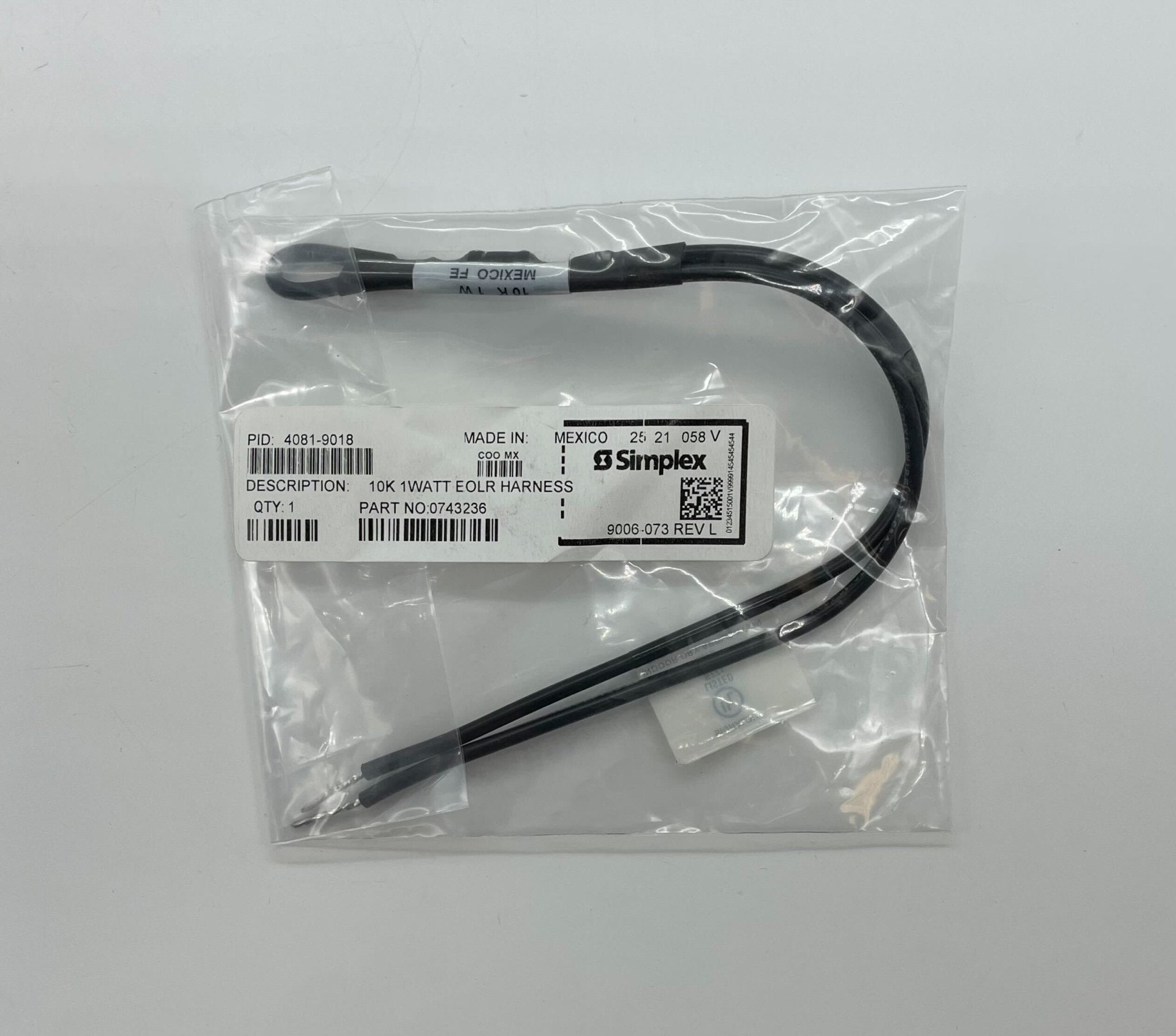 Simplex 4081-9018 EOL resistors shown on a circuit board, featuring black cylindrical components with metal leads.