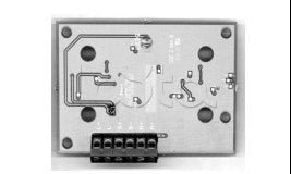 Simplex 4090-5206 fire alarm device mounted on wall, part of Simplex fire alarm system, with wiring and mounting bracket visible.