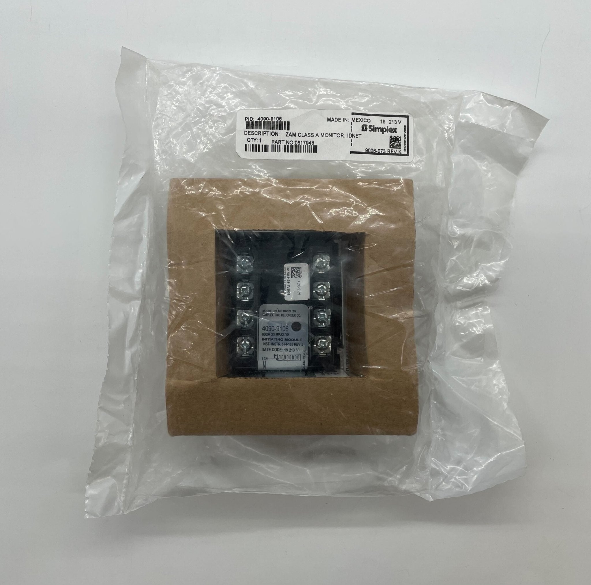 Simplex 4090-9106 fire alarm showing a sleek, white device mounted on a wall with warning labels for fire safety.