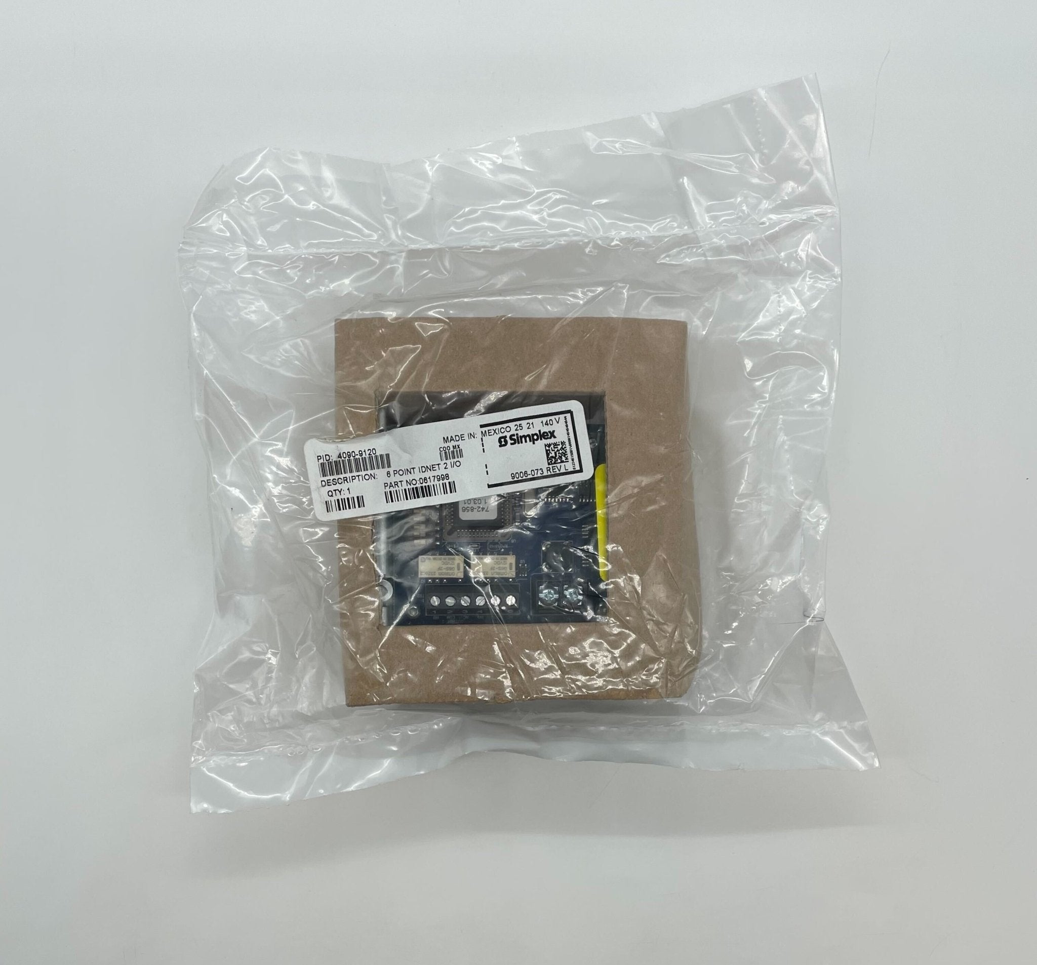 Simplex 4090-9120 fire alarm device with alarm indicator and wiring terminals, mounted on a wall.