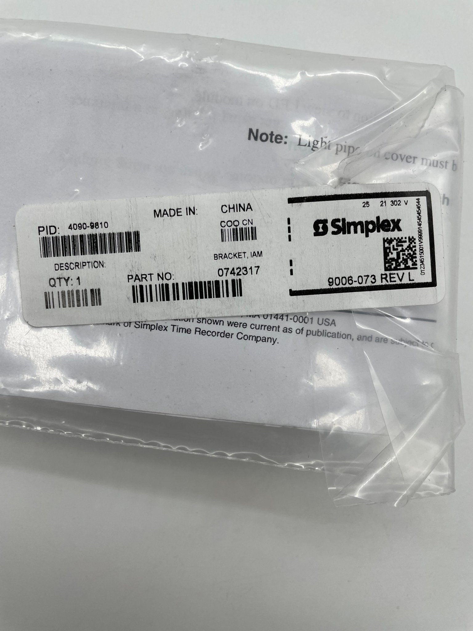 Simplex 4090-9810 brackets by Simplex, shown in a close-up image with metal construction and mounting features.