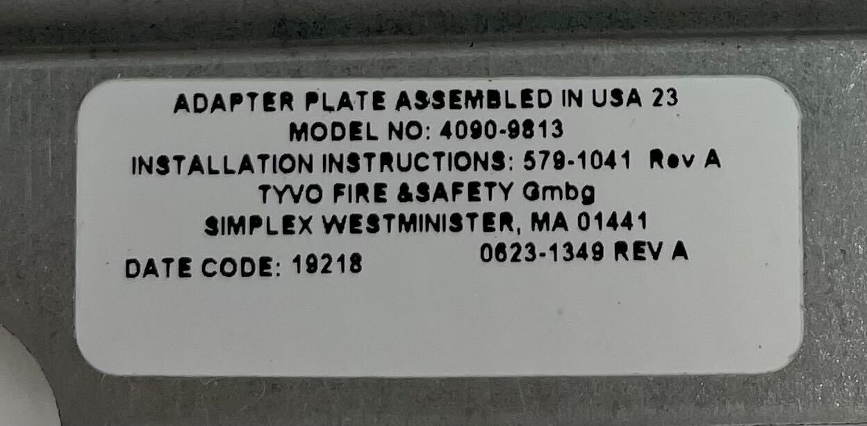 Simplex 4090-9813 fire alarm device, mounted on a wall, with visible wiring and indicator lights, designed for fire safety.
