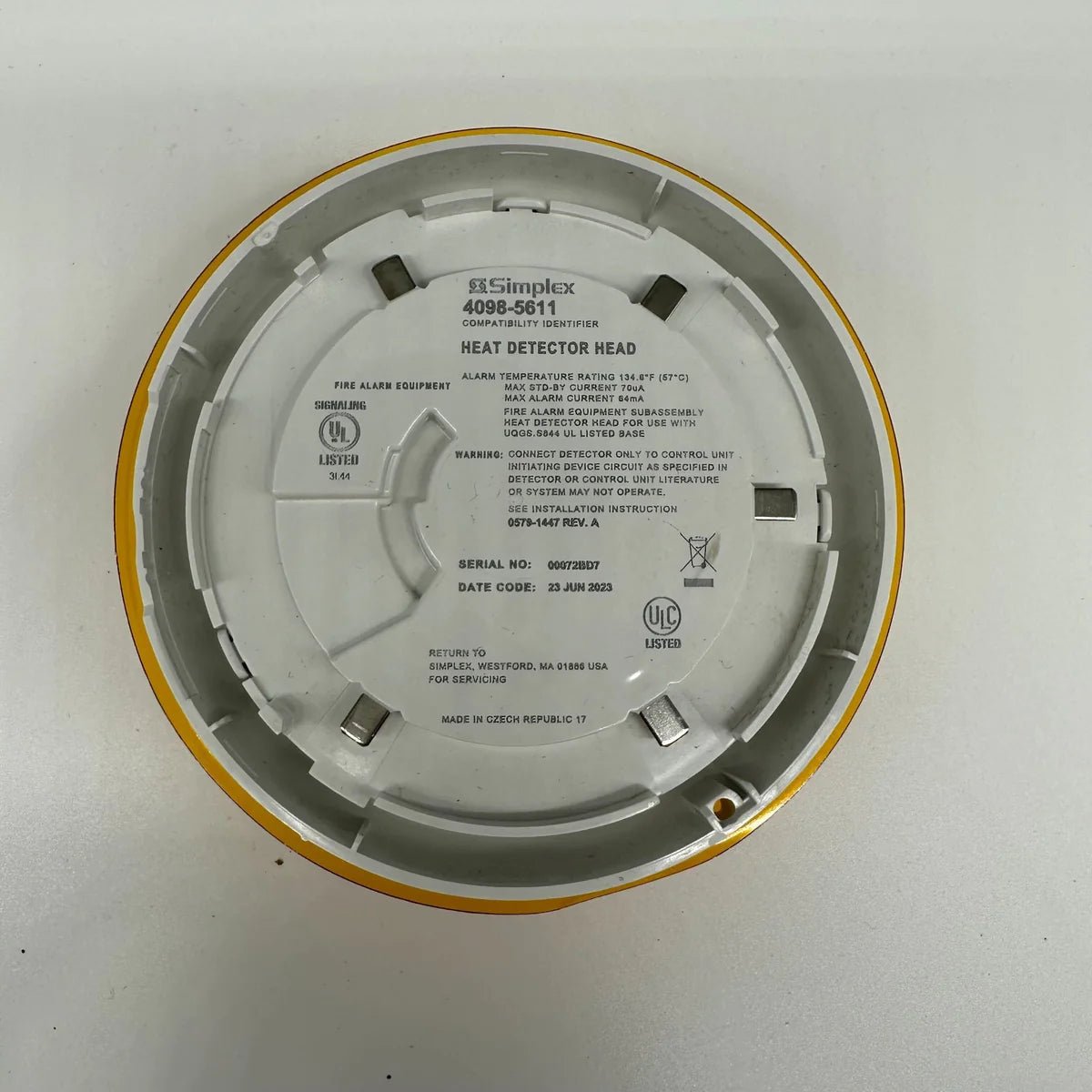 Simplex 4098-5611 fire alarm with warning indicator and mounting bracket, designed for building safety systems.
