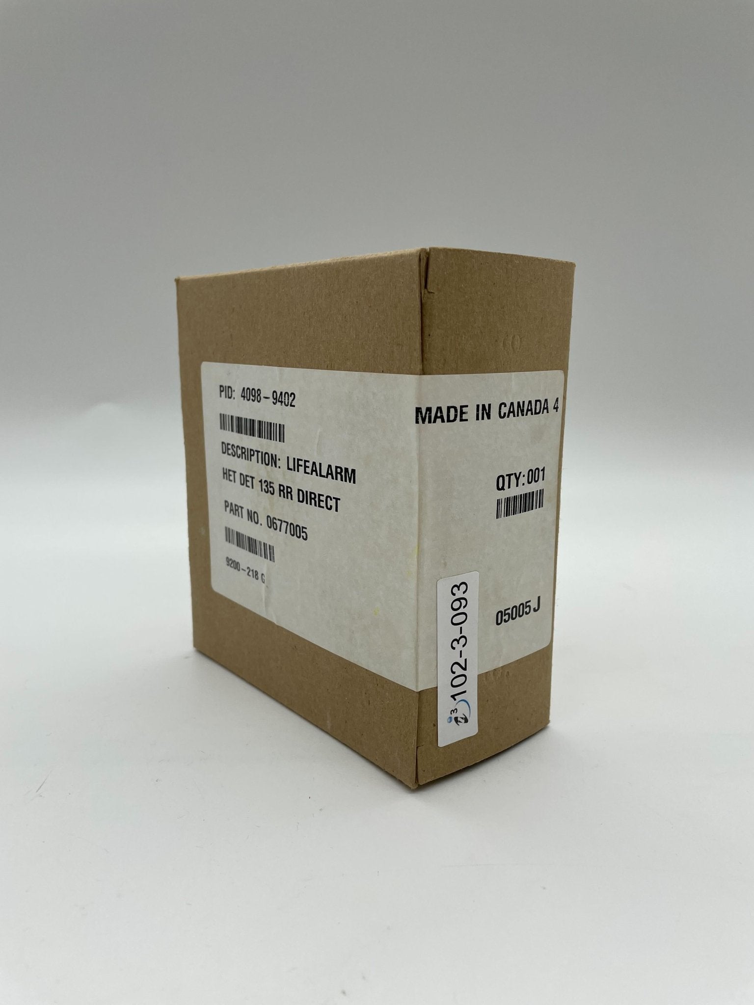 Simplex 4098-9402 heat detector with white plastic casing, designed for fire safety and alarm systems.