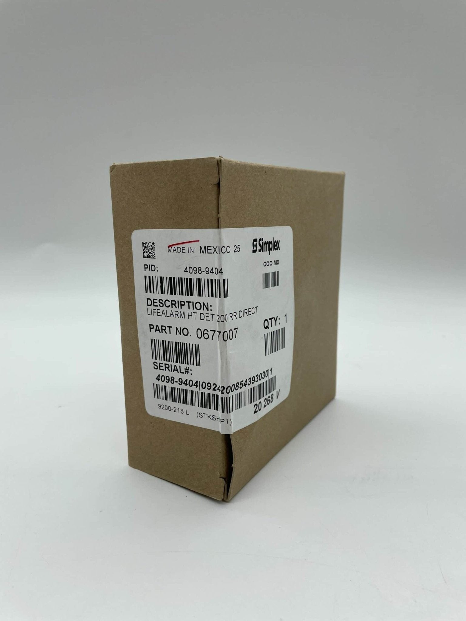 Simplex 4098-9404 fire alarm device with alarm indicator and wiring, designed for fire safety systems.