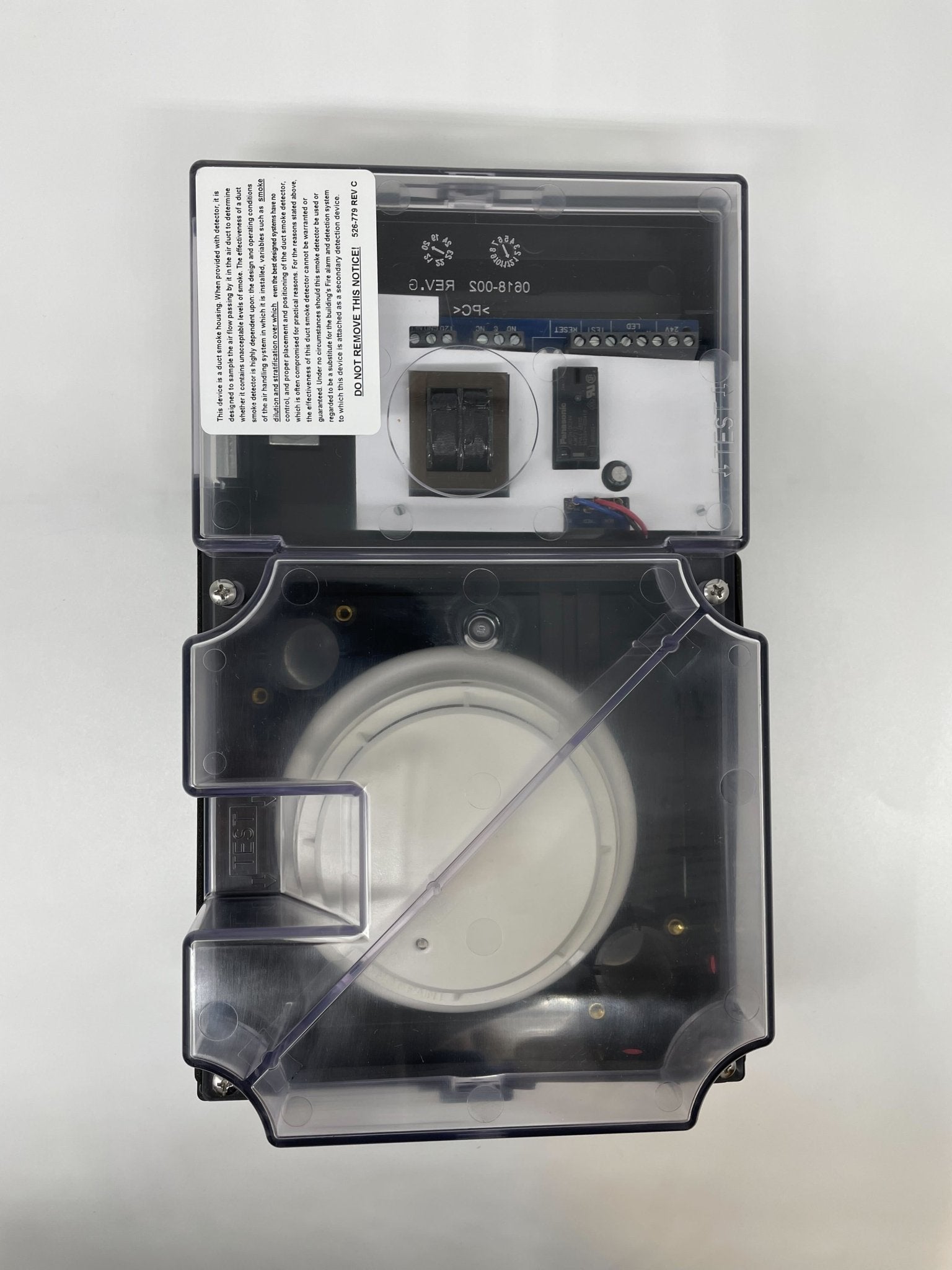 Simplex 4098-9687 duct detector installed in ceiling for fire safety, featuring compact design and wiring connections.