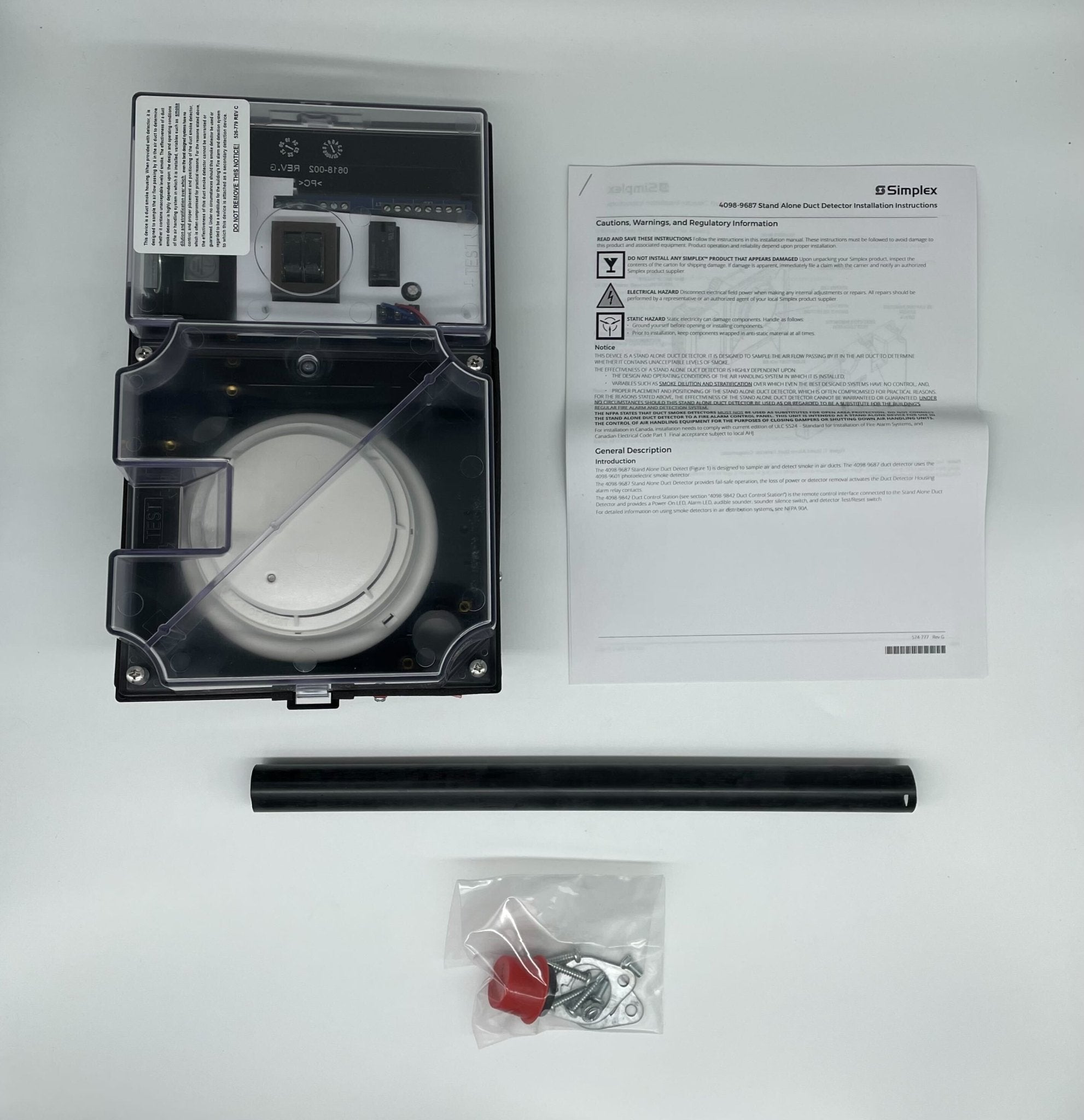 Simplex 4098-9687 duct detector installed in a ceiling, part of Simplex fire detection system with wiring and mounting hardware visible.