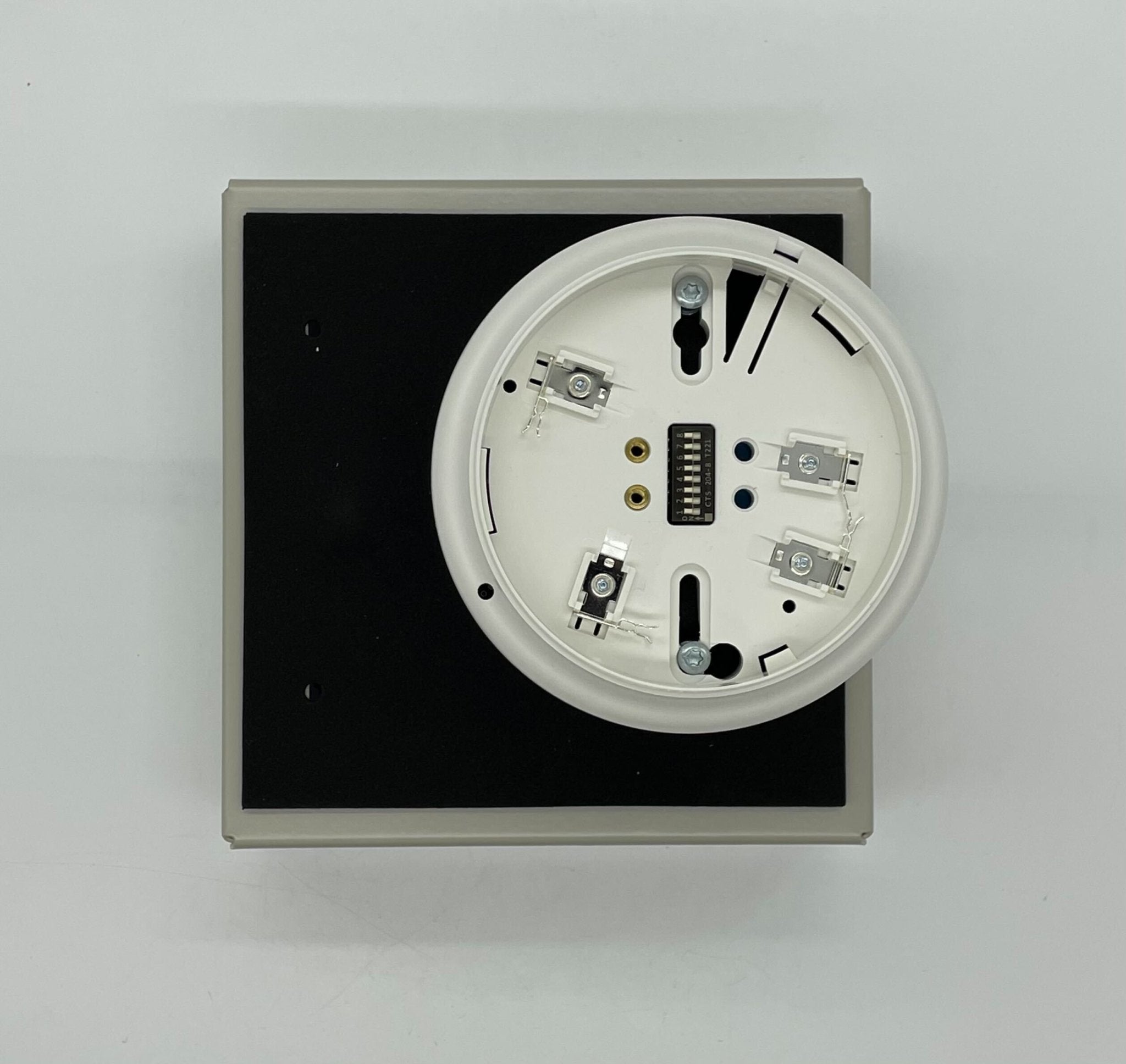 Simplex 4098-9750 duct detector showing a compact, rectangular device with wiring connections, used for fire alarm systems.