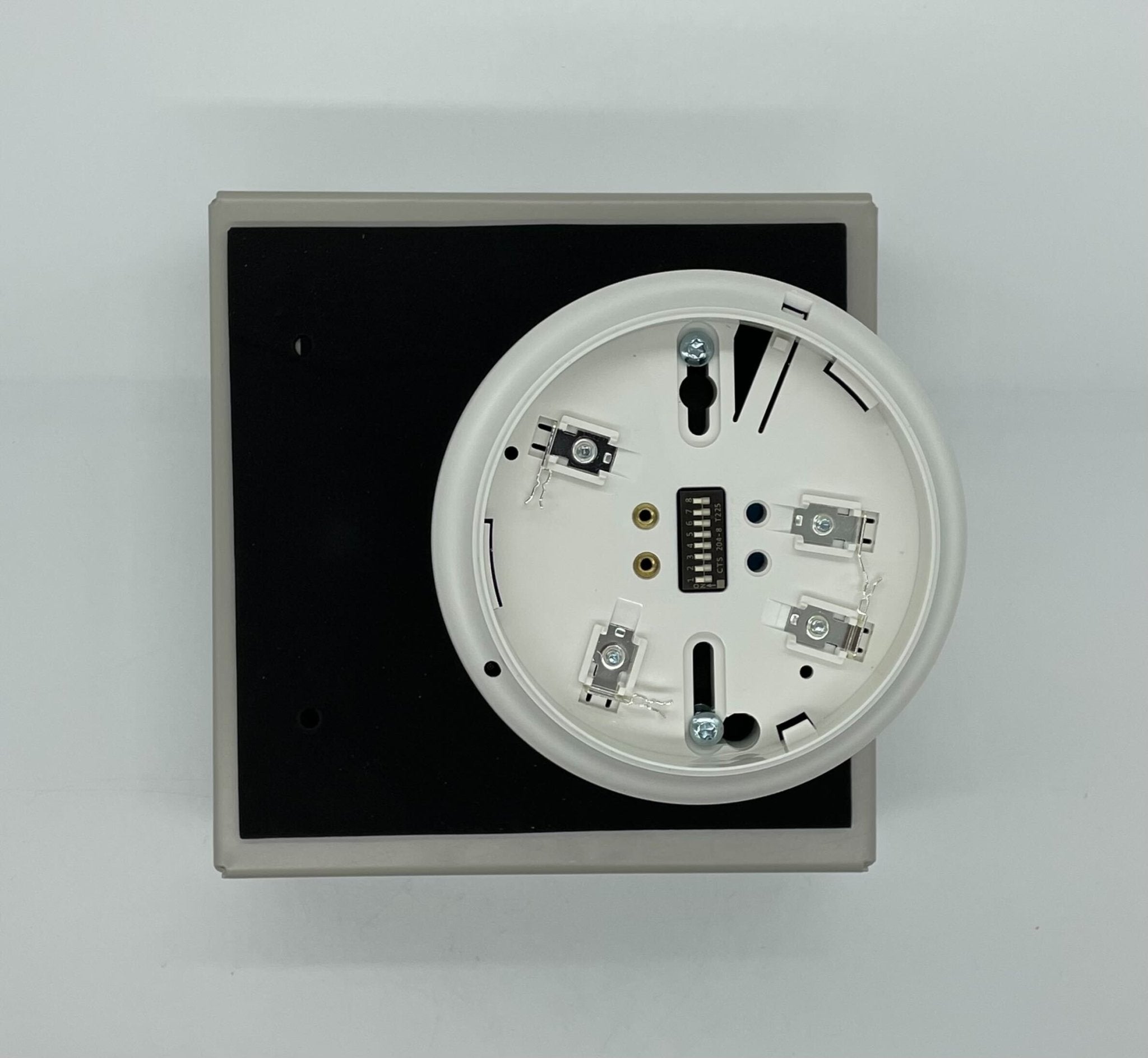 Simplex 4098-9751 duct detector shown mounted on ceiling with wiring connections, used for smoke detection in ventilation systems.