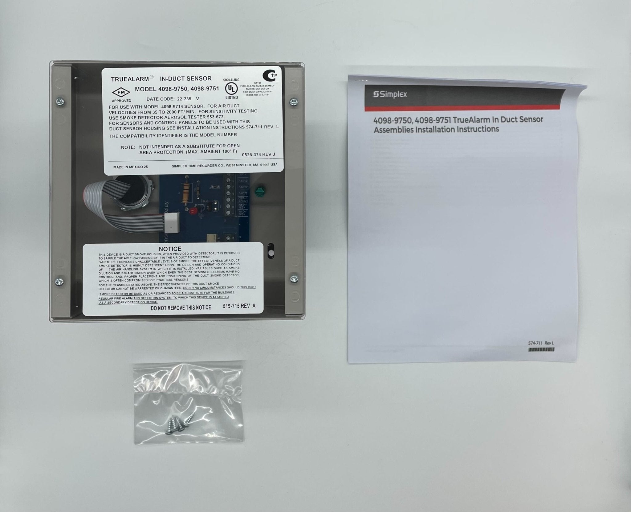 Simplex 4098-9751 duct detector installed in ceiling for fire alarm detection, with visible wiring and mounting hardware.