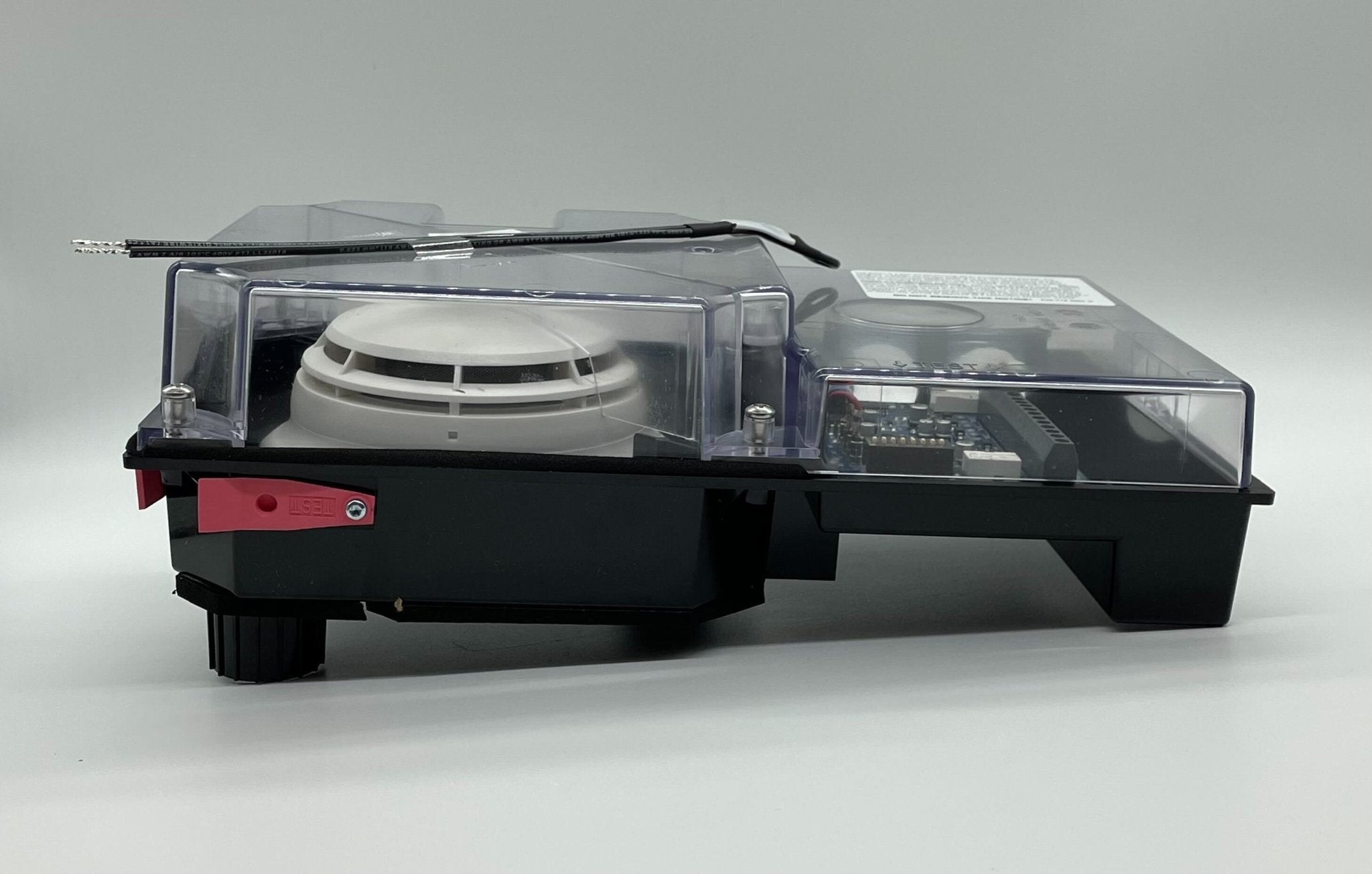 Simplex 4098-9756 duct detector mounted on ceiling, part of Simplex fire alarm system for building safety.