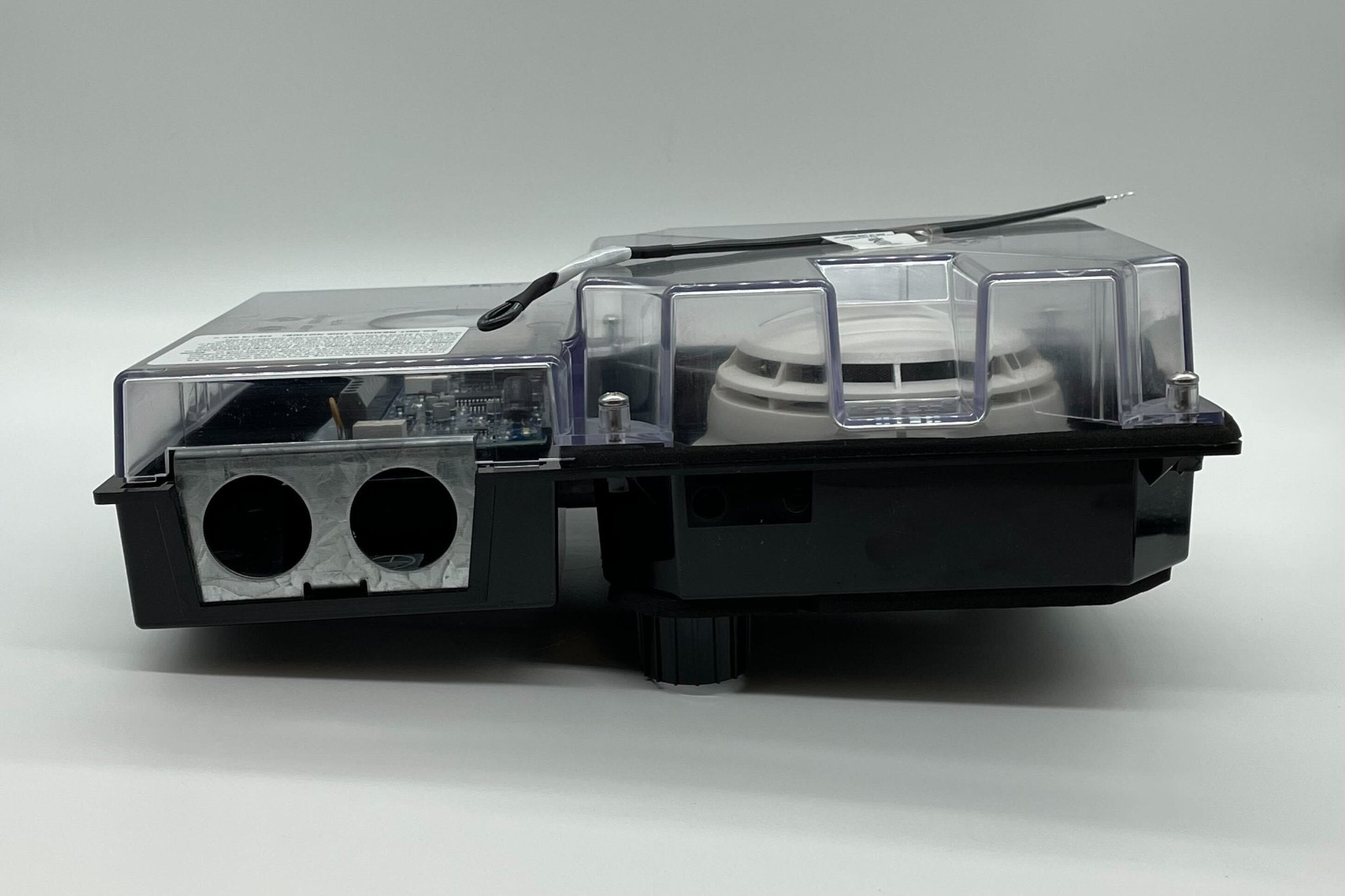 Simplex 4098-9756 duct detector mounted on ceiling for smoke detection in HVAC systems.