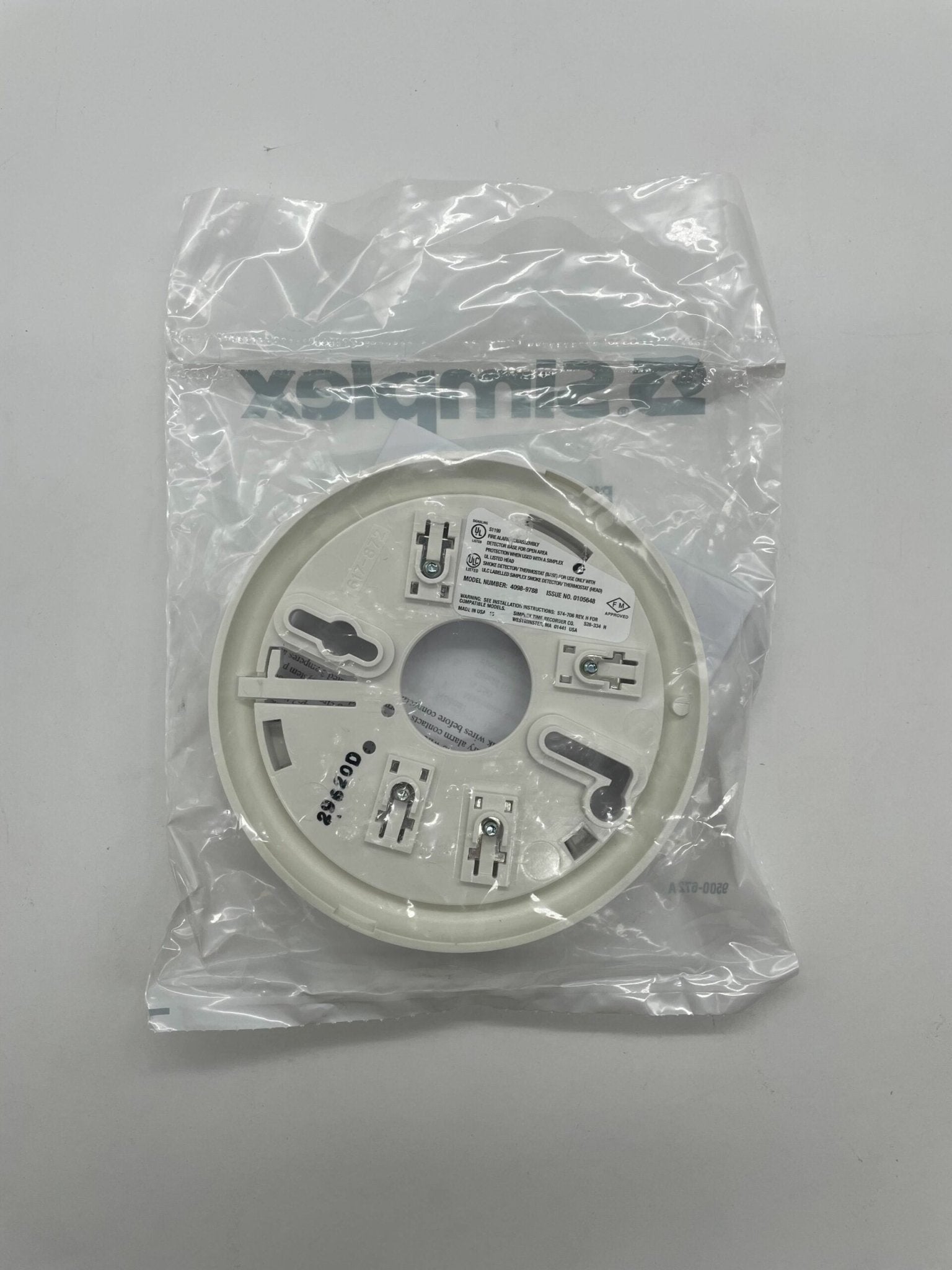 Simplex 4098-9788 base, black plastic component for security systems, shown in a clear close-up image.