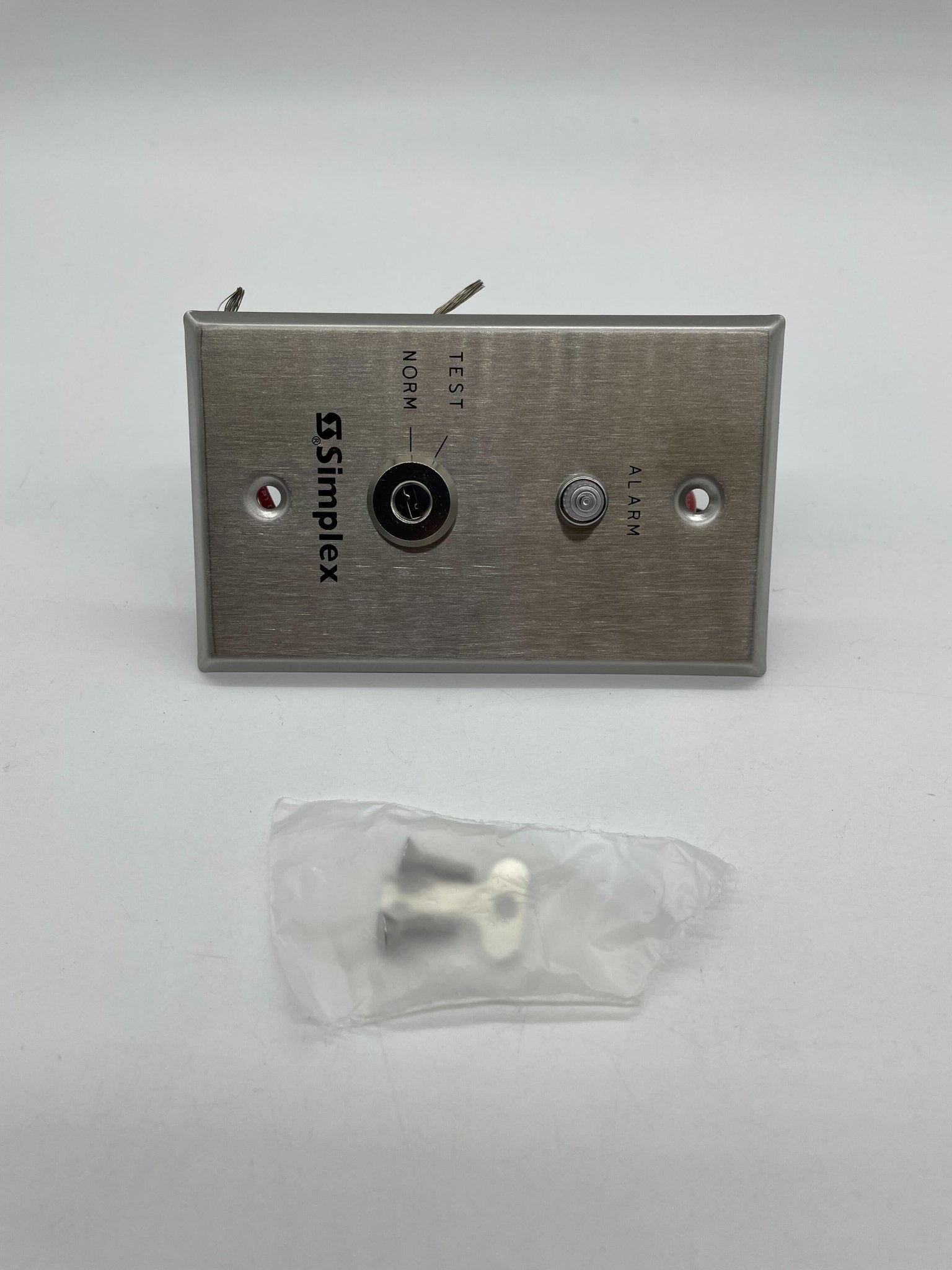 Simplex 4098-9834 fire alarm with digital display and sensor, mounted on wall in a safety control panel setting