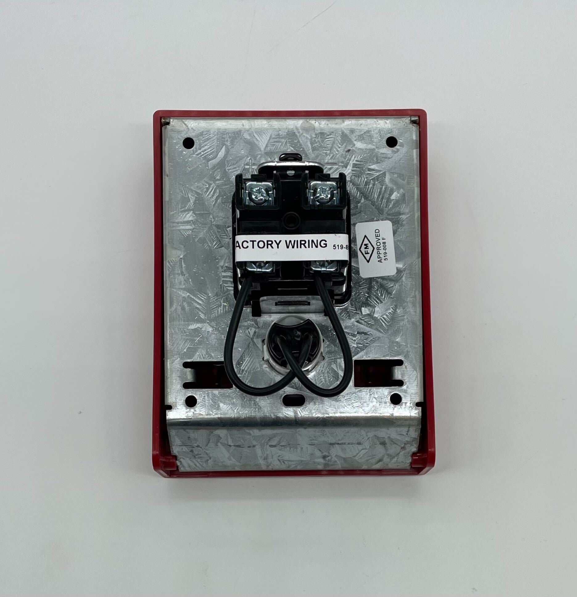 Simplex 4099-9015 pull station, fire alarm manual pull station with red cover and black activation handle, mounted on wall.