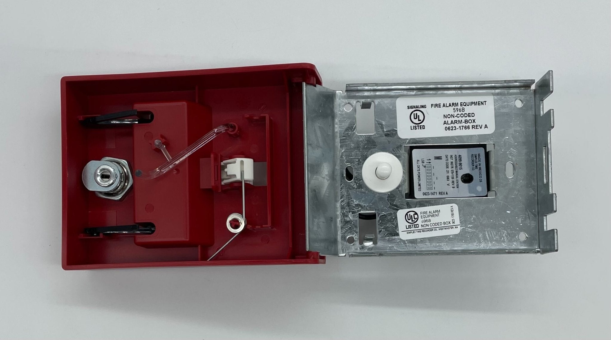 Simplex 4099-9015 pull station used for emergency alarm systems, featuring a red rectangular button and metal casing.