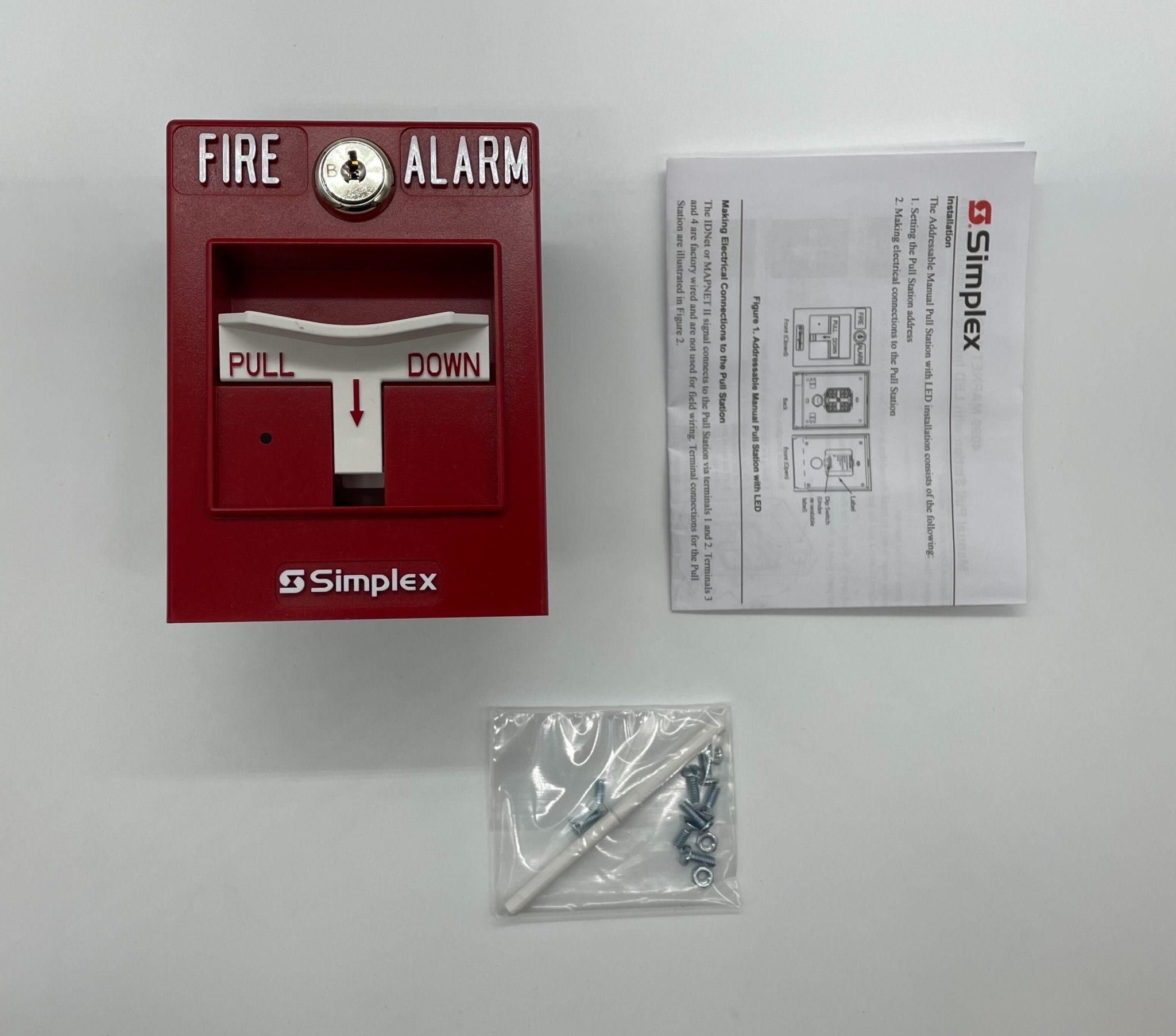 Simplex 4099-9021 pull station in black with red activation handle mounted on wall for fire alarm system.