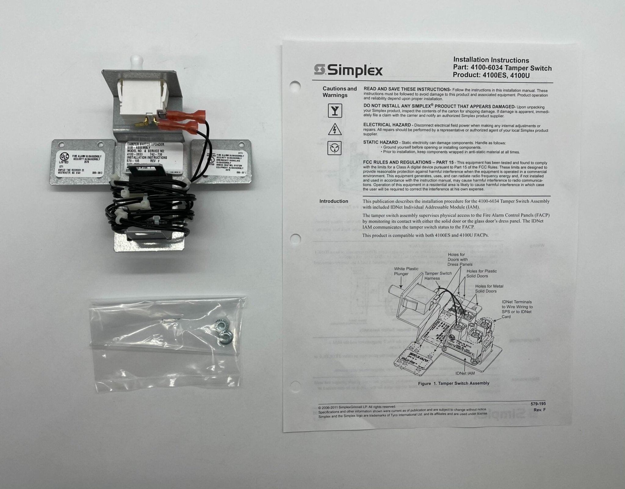 Simplex 4100-0633 fire alarm unit with control panel and wiring for fire safety system.