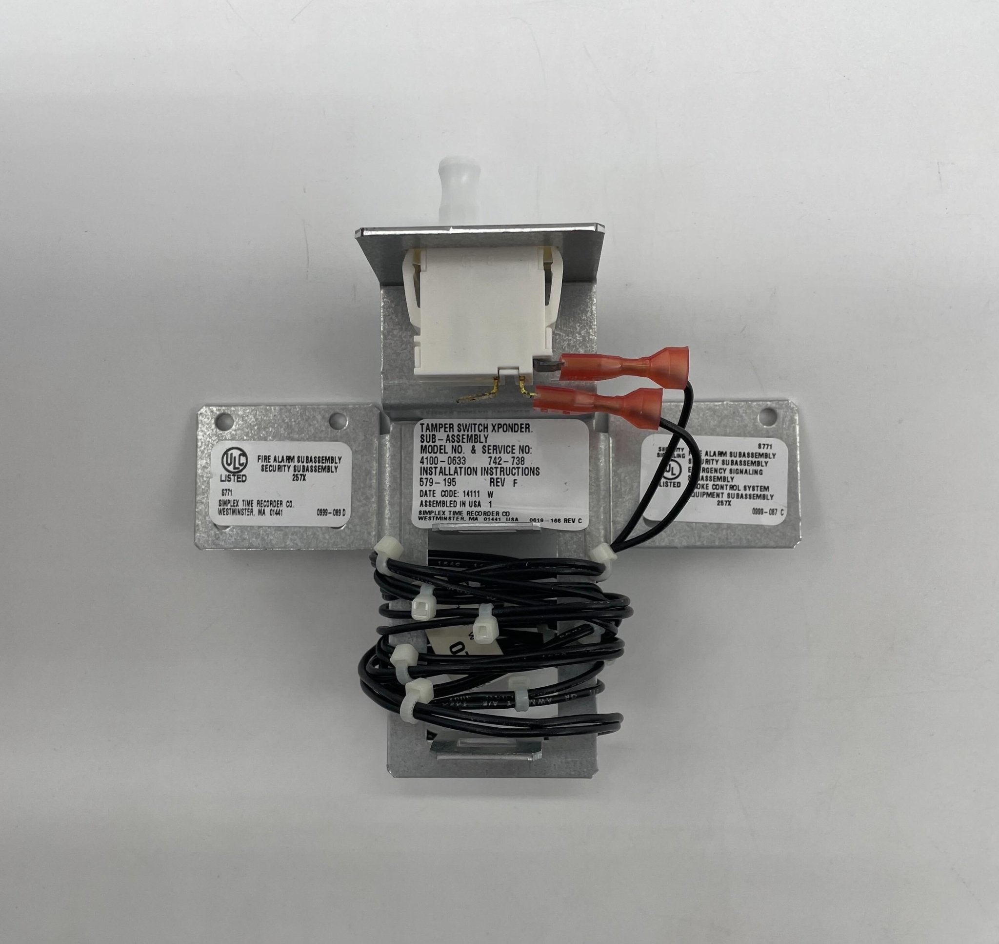 Simplex 4100-0633 fire alarm device with warning indicator and mounting components, branded by Simplex.