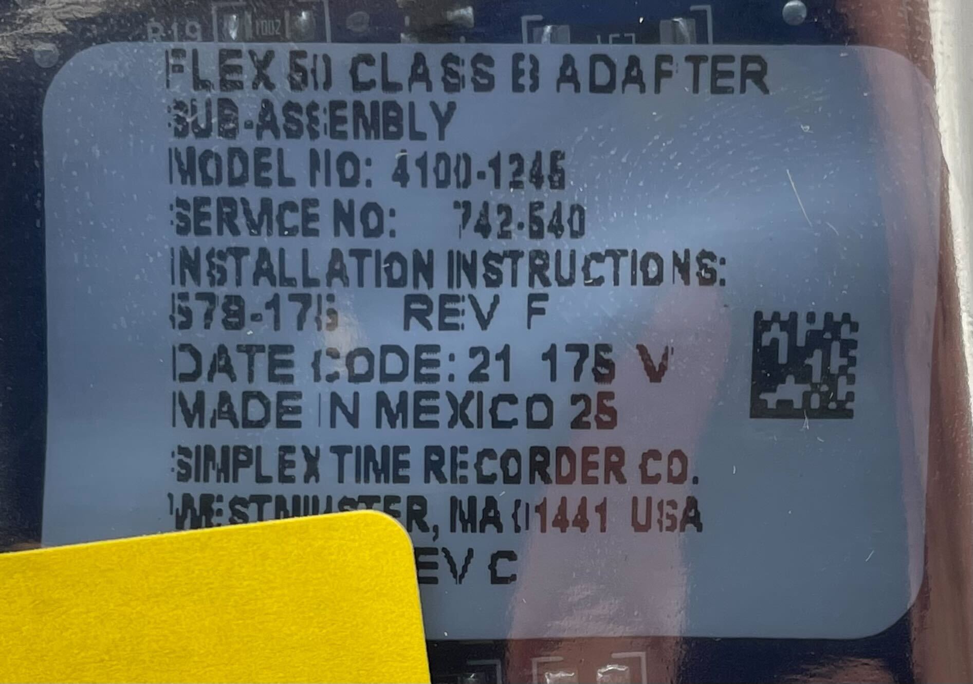 Simplex 4100-1245 fire alarm system with control panel and wiring, branded Simplex, installed in a building for fire safety.