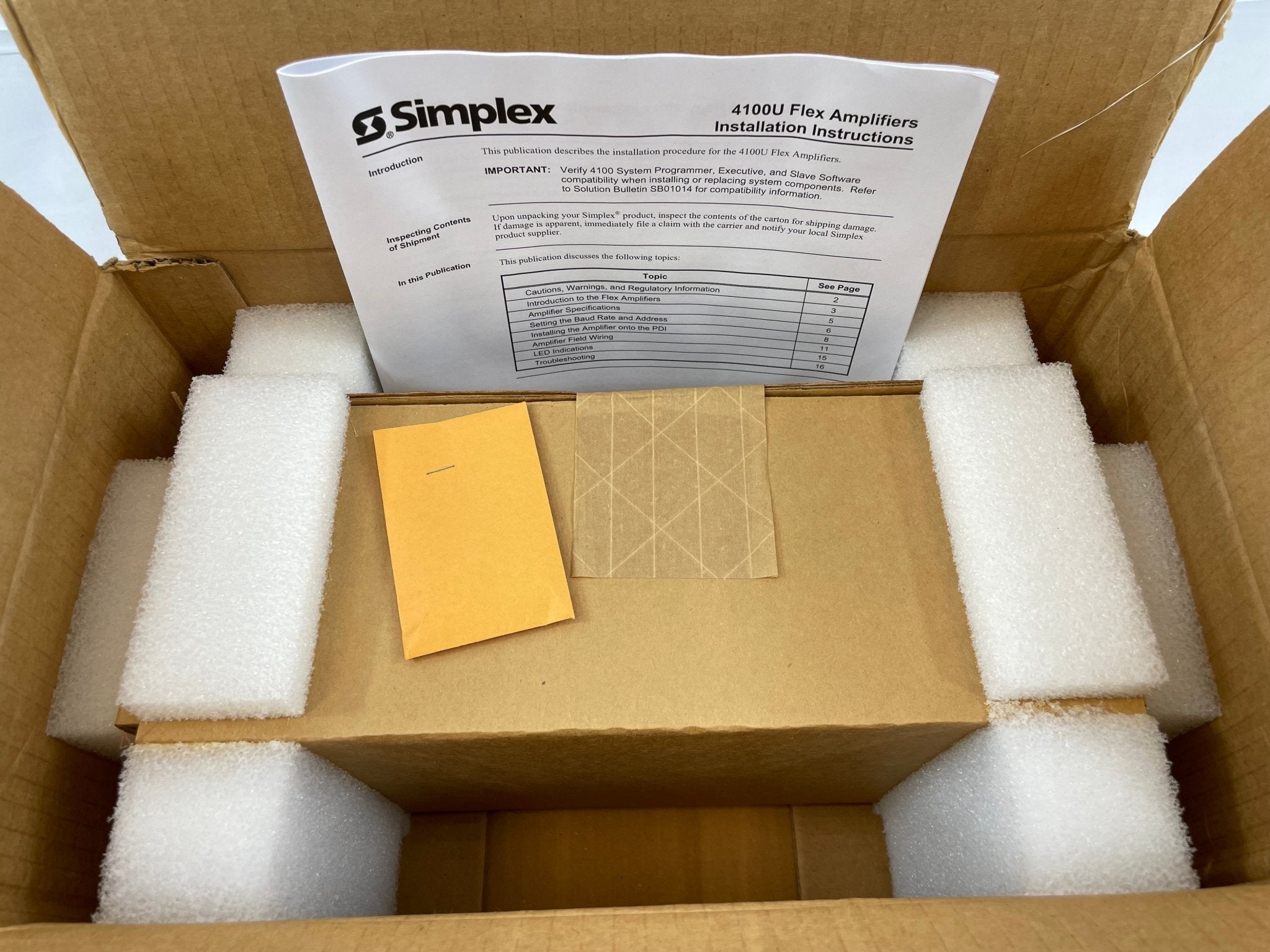 Simplex 4100-1327 amplifier by Simplex, shown with front panel controls and connections, used for communication systems.
