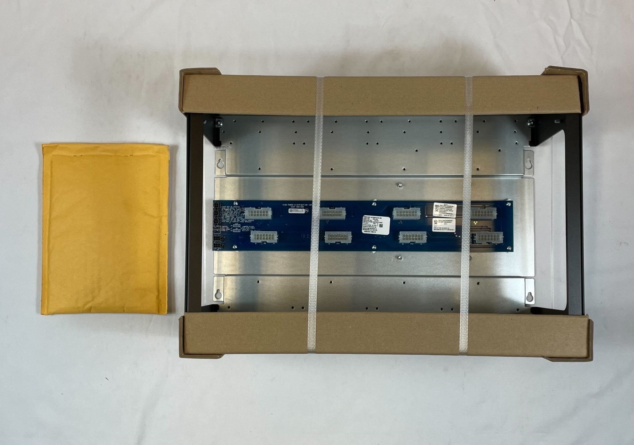 Simplex 4100-2300 fire alarm control panel with digital display and alarm indicators, installed on a wall.
