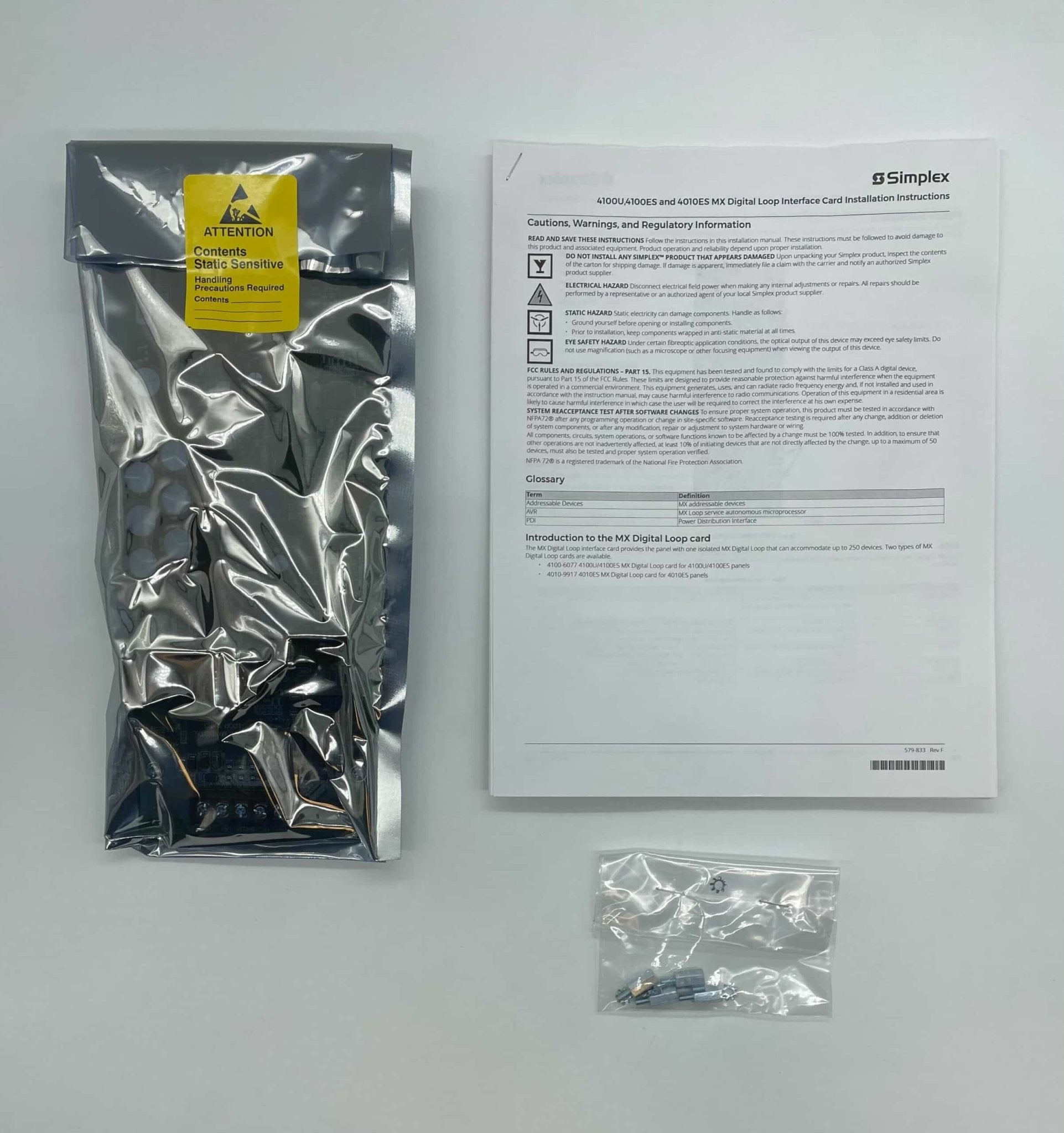 Simplex 4100-6077 modules, industrial control components, with visible circuit connections and brand markings.