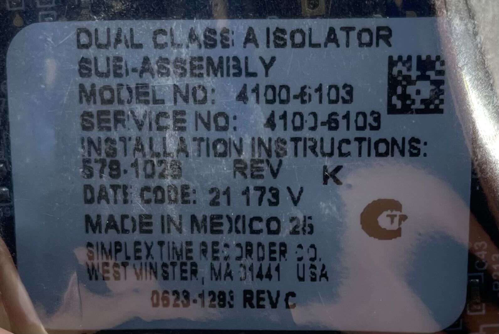 Simplex 4100-6103 fire alarm device with alarm indicator and control panel, used for fire safety systems.
