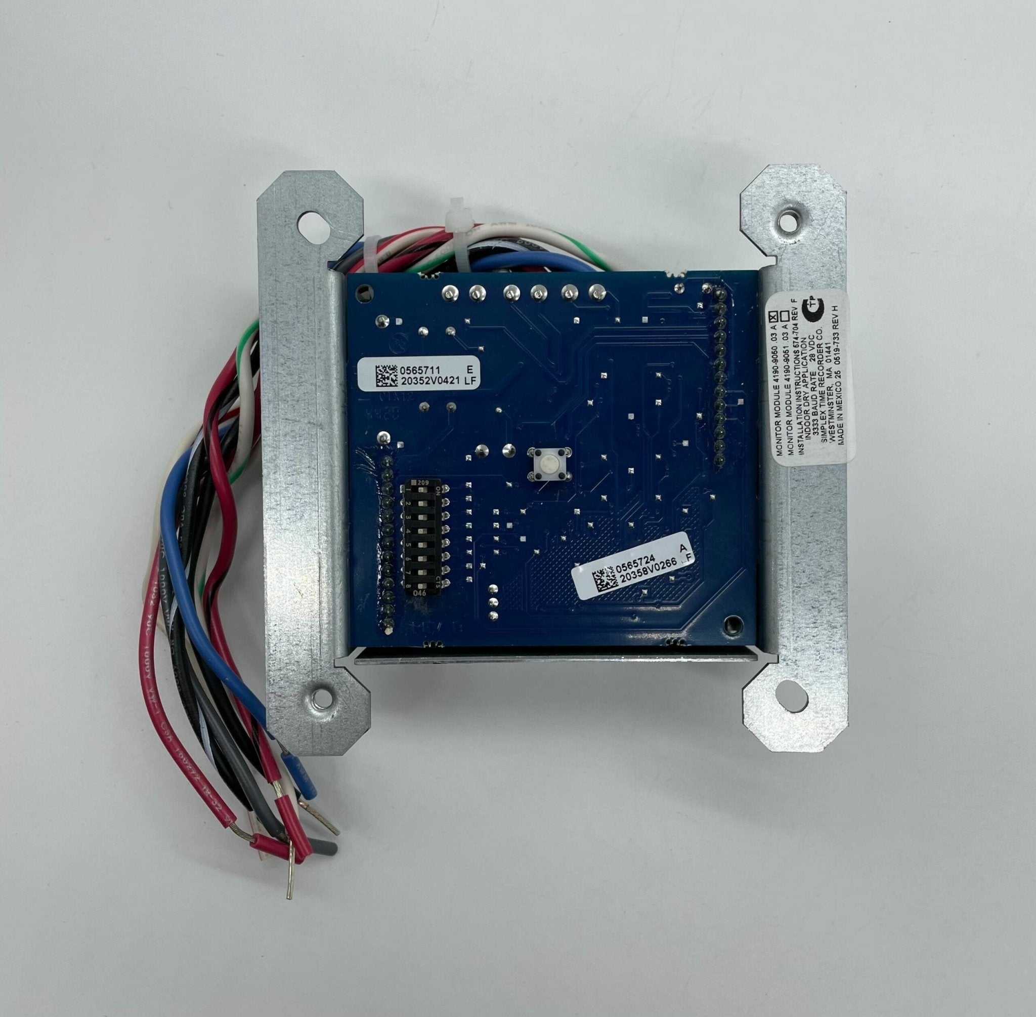 Simplex 4190-9050 fire alarm with a digital display and sensor, mounted on a ceiling for fire safety detection.