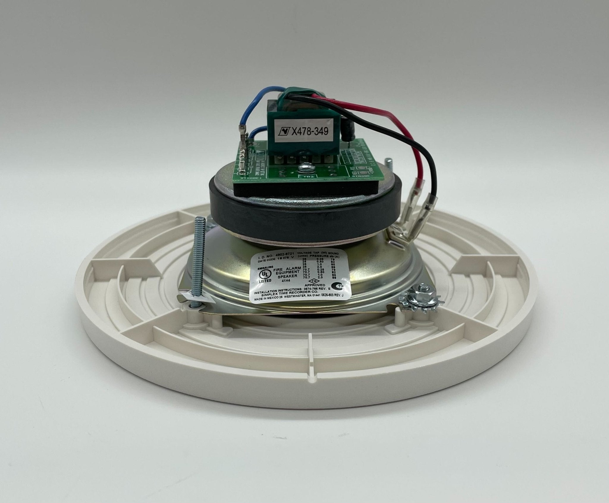 Simplex 4902-9721 fire alarm unit, mounted on wall, with visible wiring and brand label, designed for fire safety.