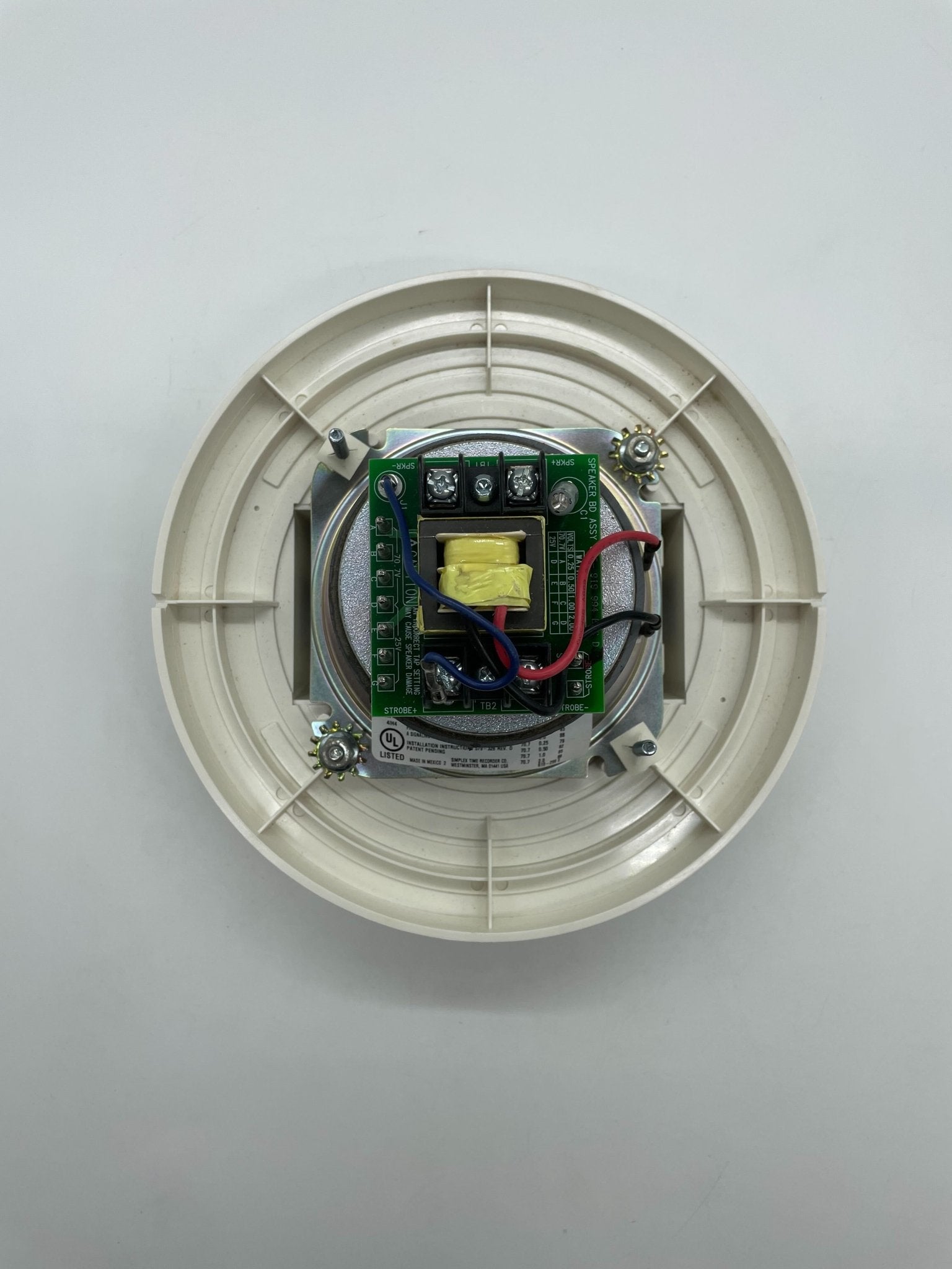 Simplex 4903-9197 fire alarm device with white plastic casing and mounting bracket, designed for safety and fire detection.