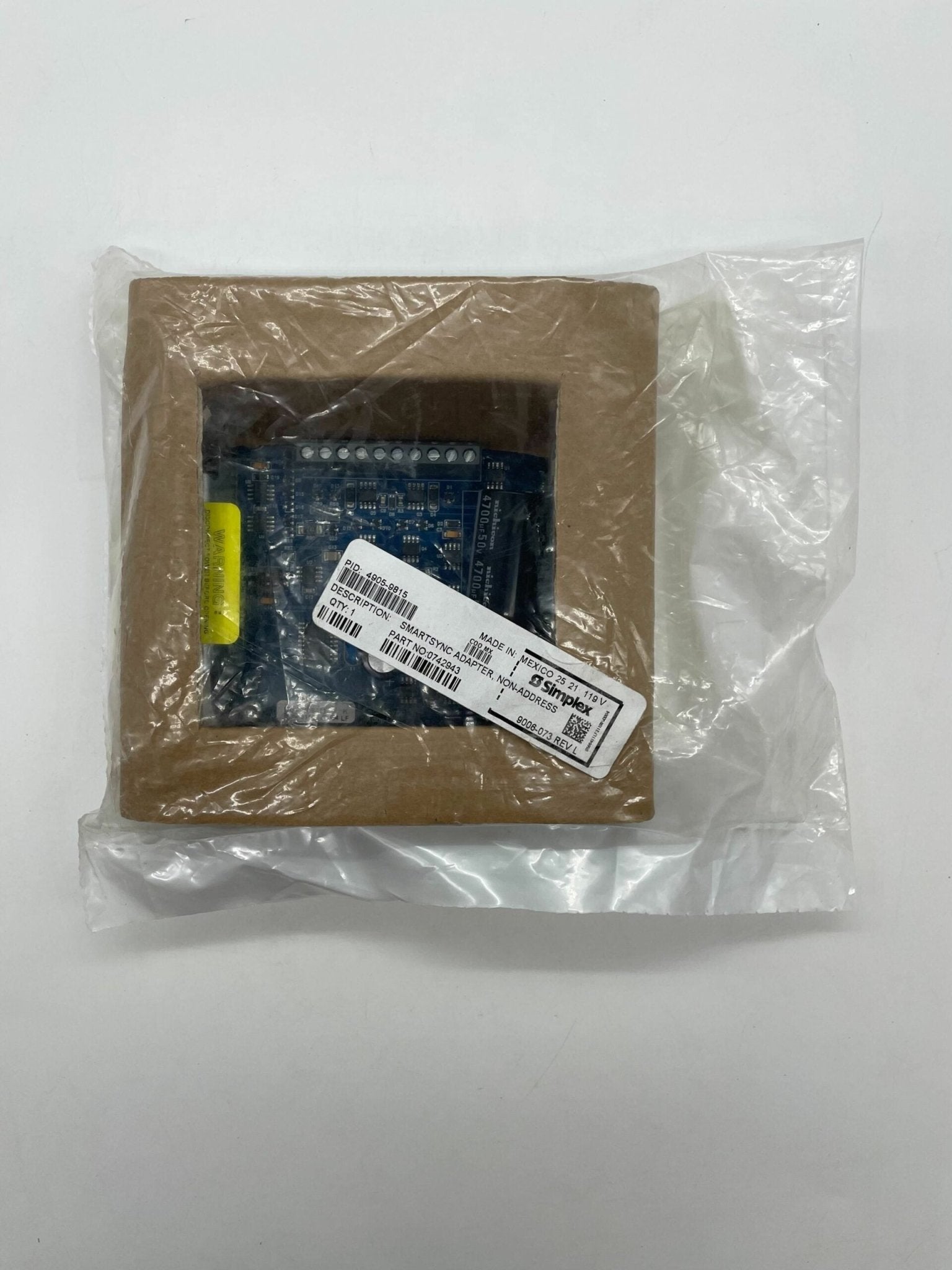 Simplex 4905-9815 fire alarm device by Simplex, showing the alarm unit with mounting hardware and safety labels.